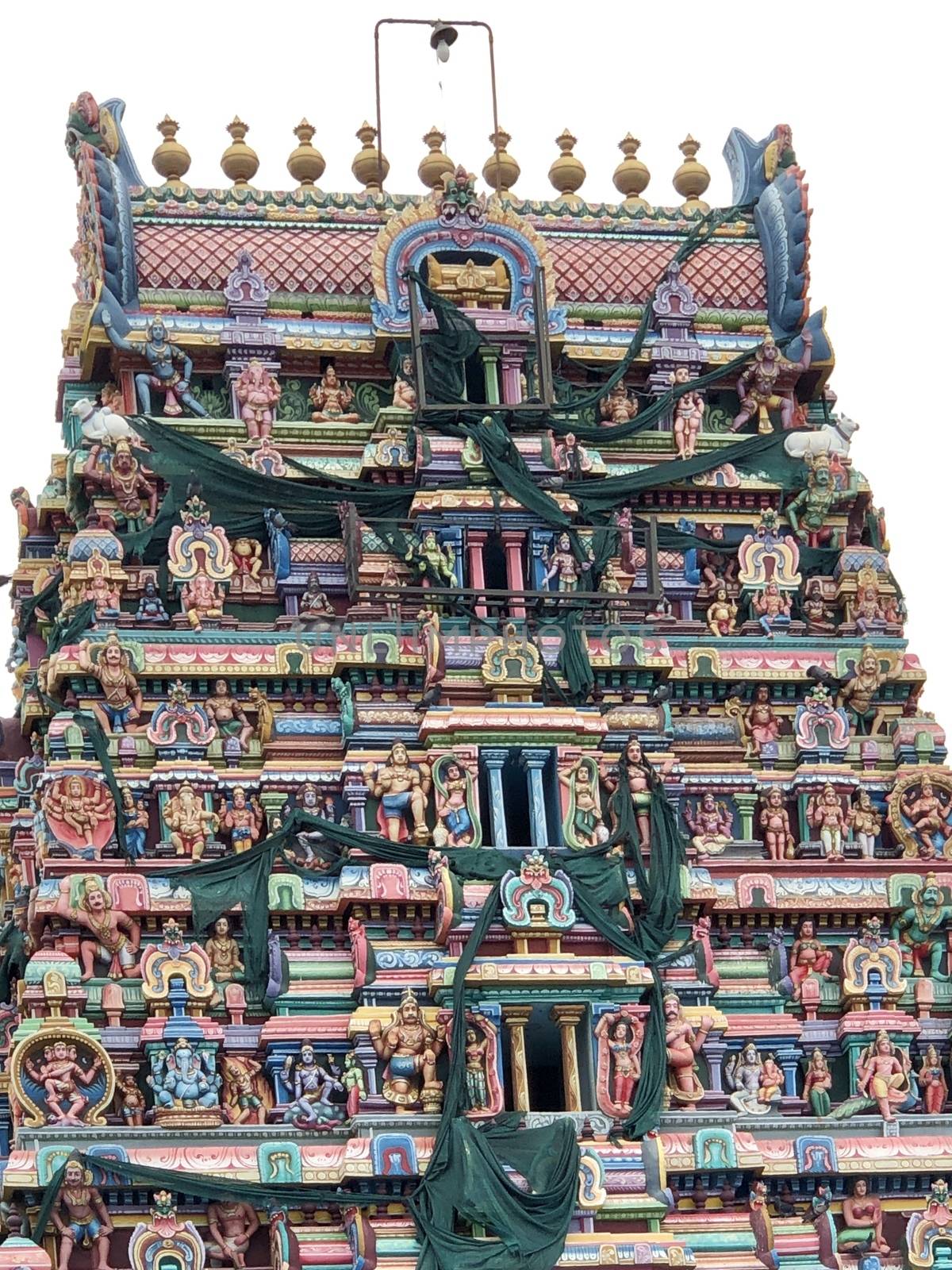Temple with beautiful goupuram and sculptures in it with clear sky background