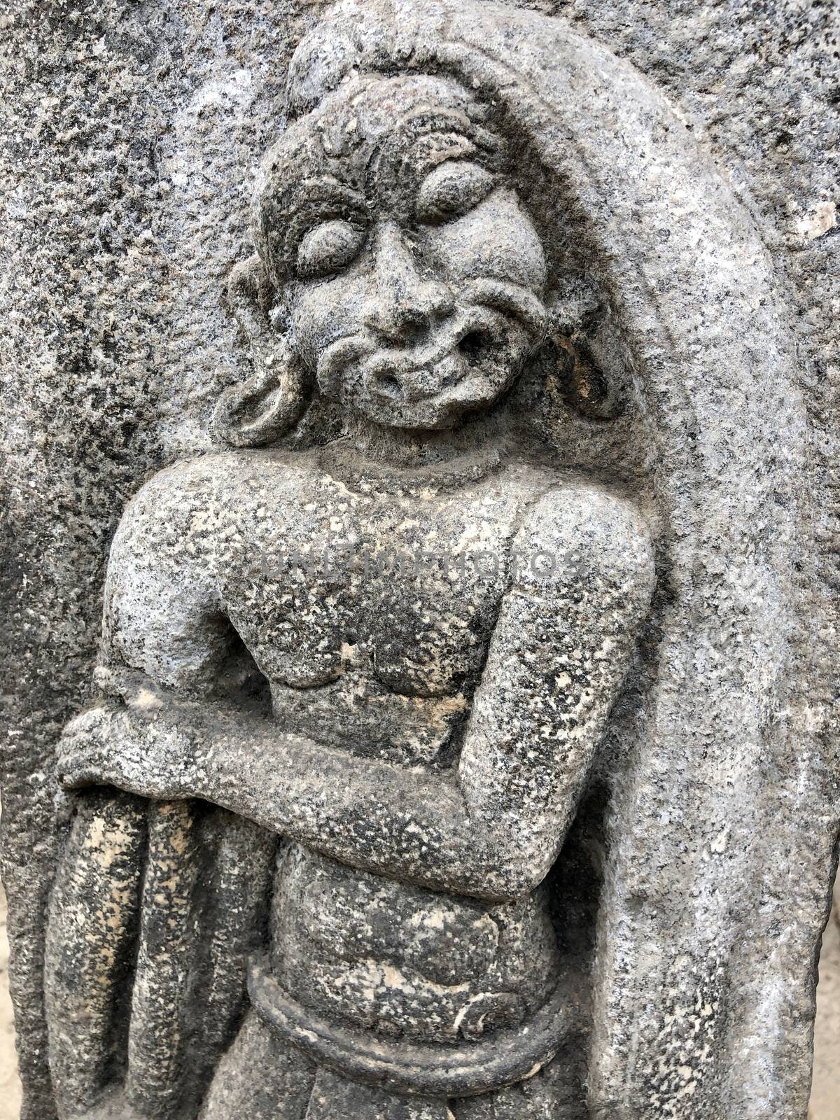 Ancient stone carvings of beautiful sculptures found in the temple in Tamilnadu. Beautiful bas-relief sculptures carved in the granite stone walls.