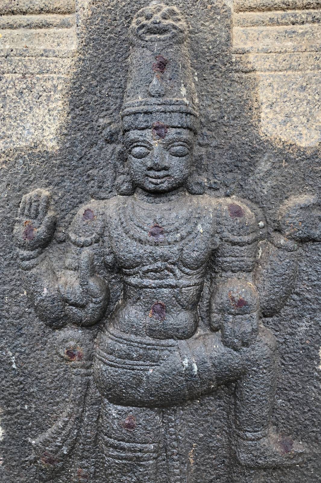 Bas relief sculpture oh God carved in the stone walls of Shiva temple, Tamil nadu by prabhakaran851