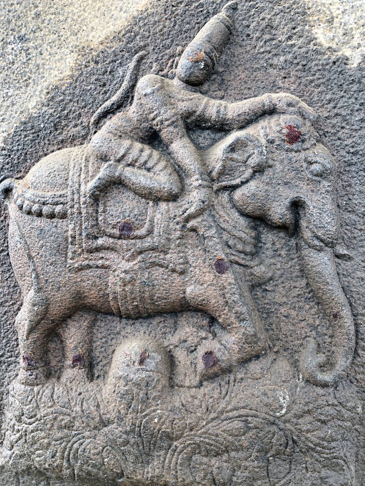 Ancient stone carvings of beautiful sculptures found in the temple in Tamilnadu. Beautiful bas-relief sculptures carved in the granite stone walls.