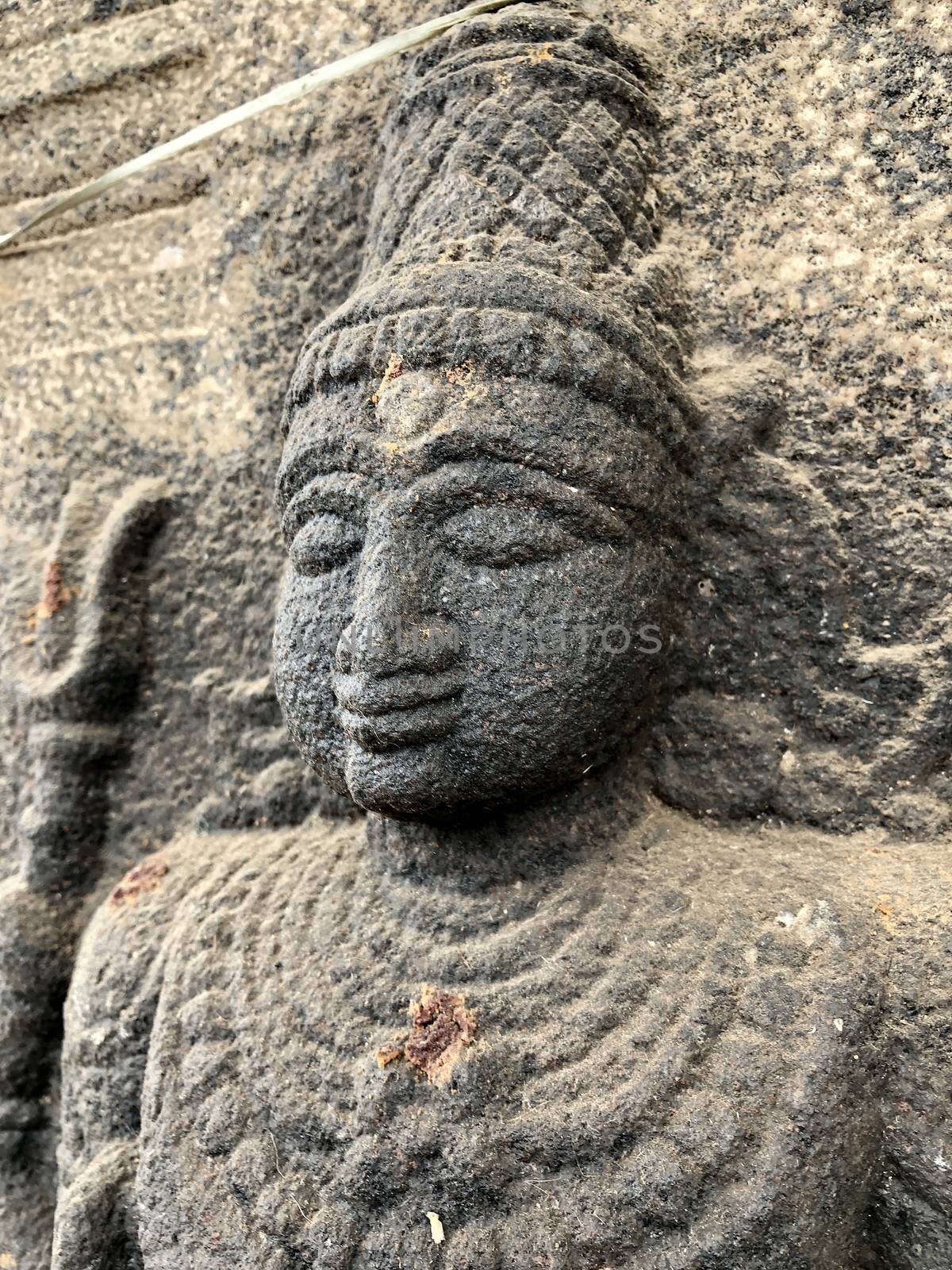 Ancient stone carvings of beautiful sculptures found in the temple in Tamilnadu. Beautiful bas-relief sculptures carved in the granite stone walls.