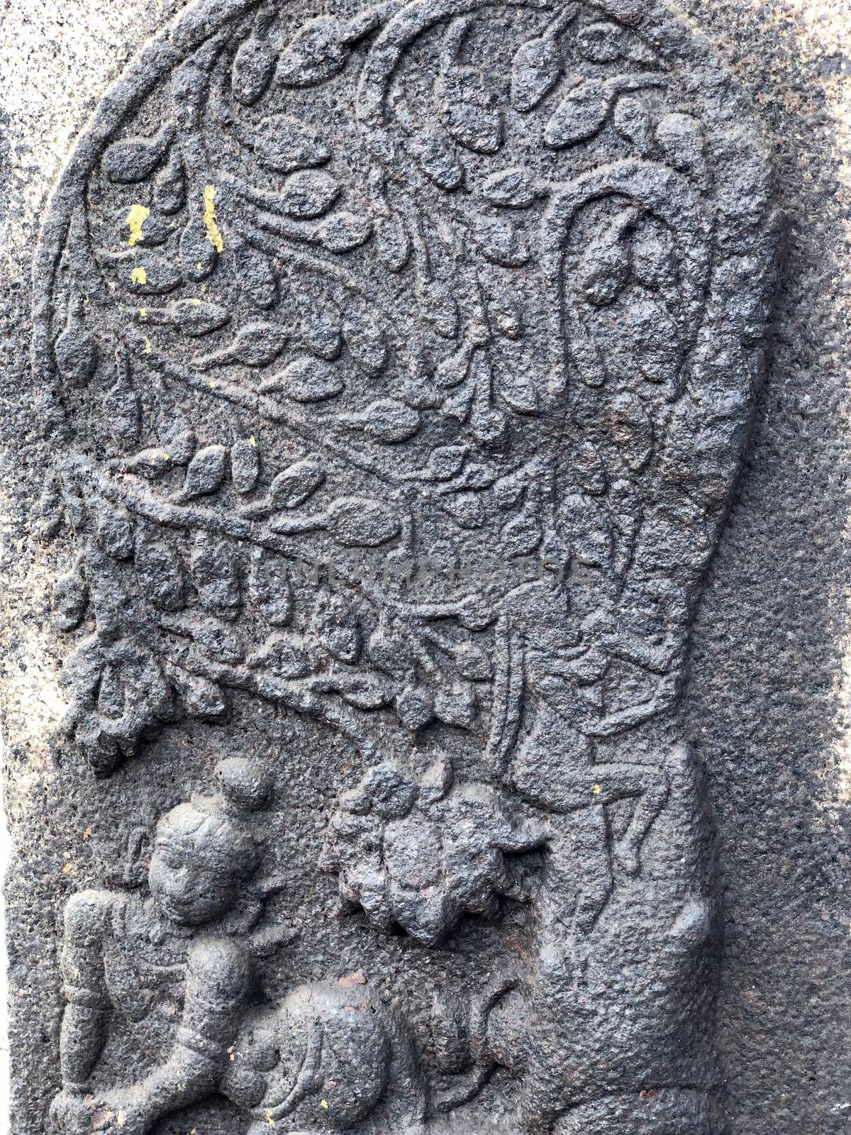 Ancient stone carvings of beautiful sculptures found in the temple in Tamilnadu. Beautiful bas-relief sculptures carved in the granite stone walls.