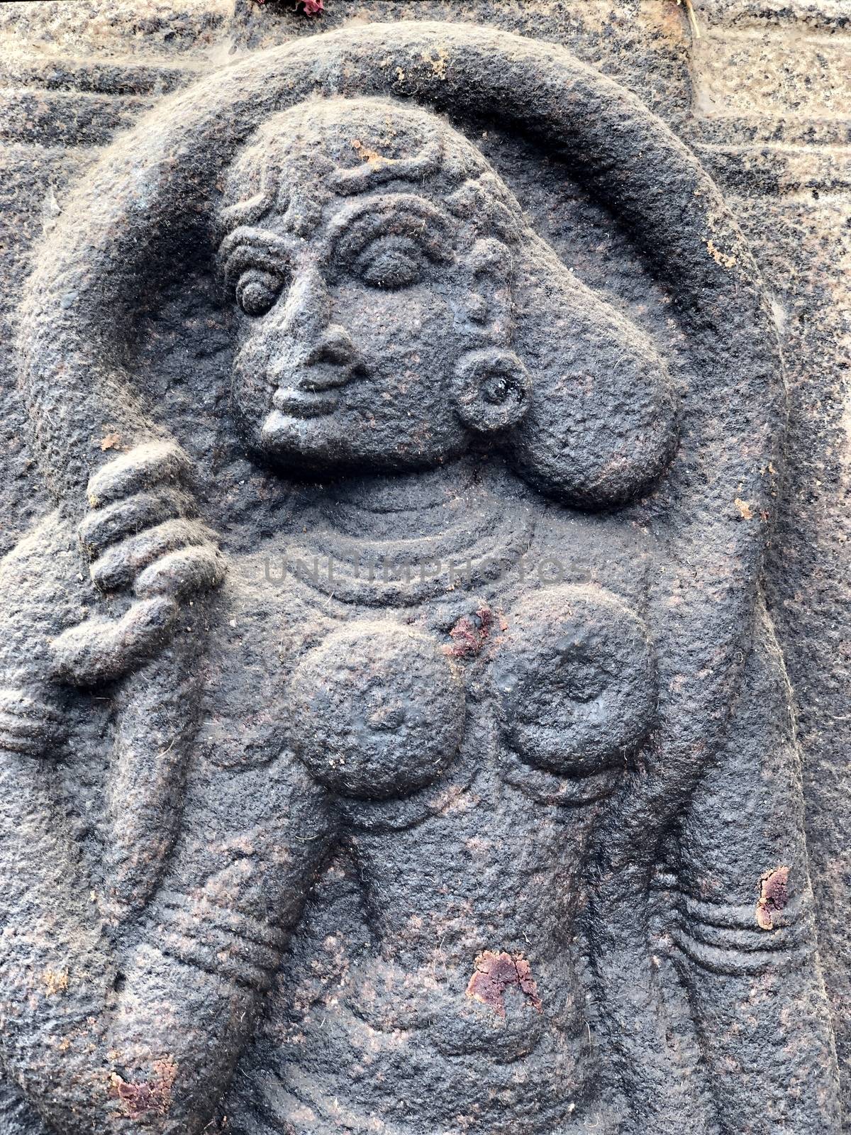 Women with beautiful hair decoration sculpture. Bas relief sculpture carved in the stone walls at Shiva temple in Tamil nadu by prabhakaran851
