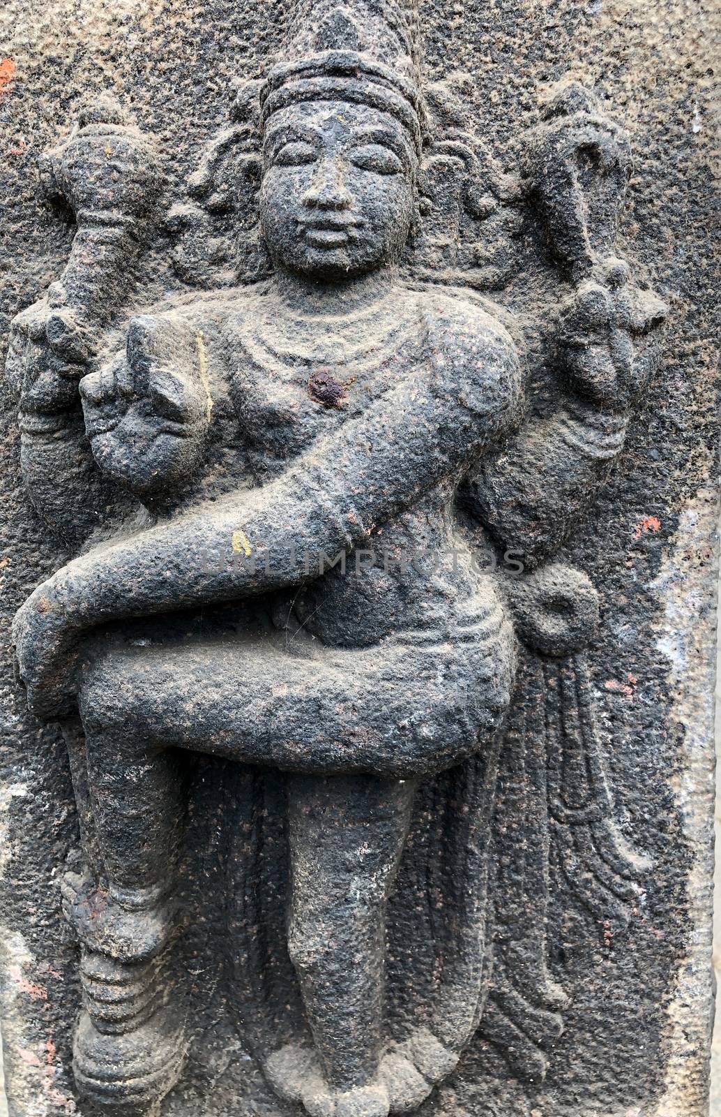 Ancient stone carvings of beautiful sculptures found in the temple in Tamilnadu. Beautiful bas-relief sculptures carved in the granite stone walls.