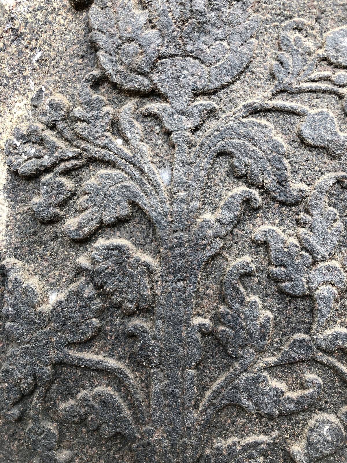Ancient stone carvings of beautiful sculptures found in the temple in Tamilnadu. Beautiful bas-relief sculptures carved in the granite stone walls.