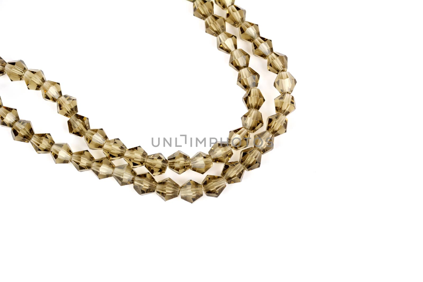 Beautiful beige Glass Sparkle Crystal Isoalted Beads on white background. Use for diy beaded jewelry. Space for text