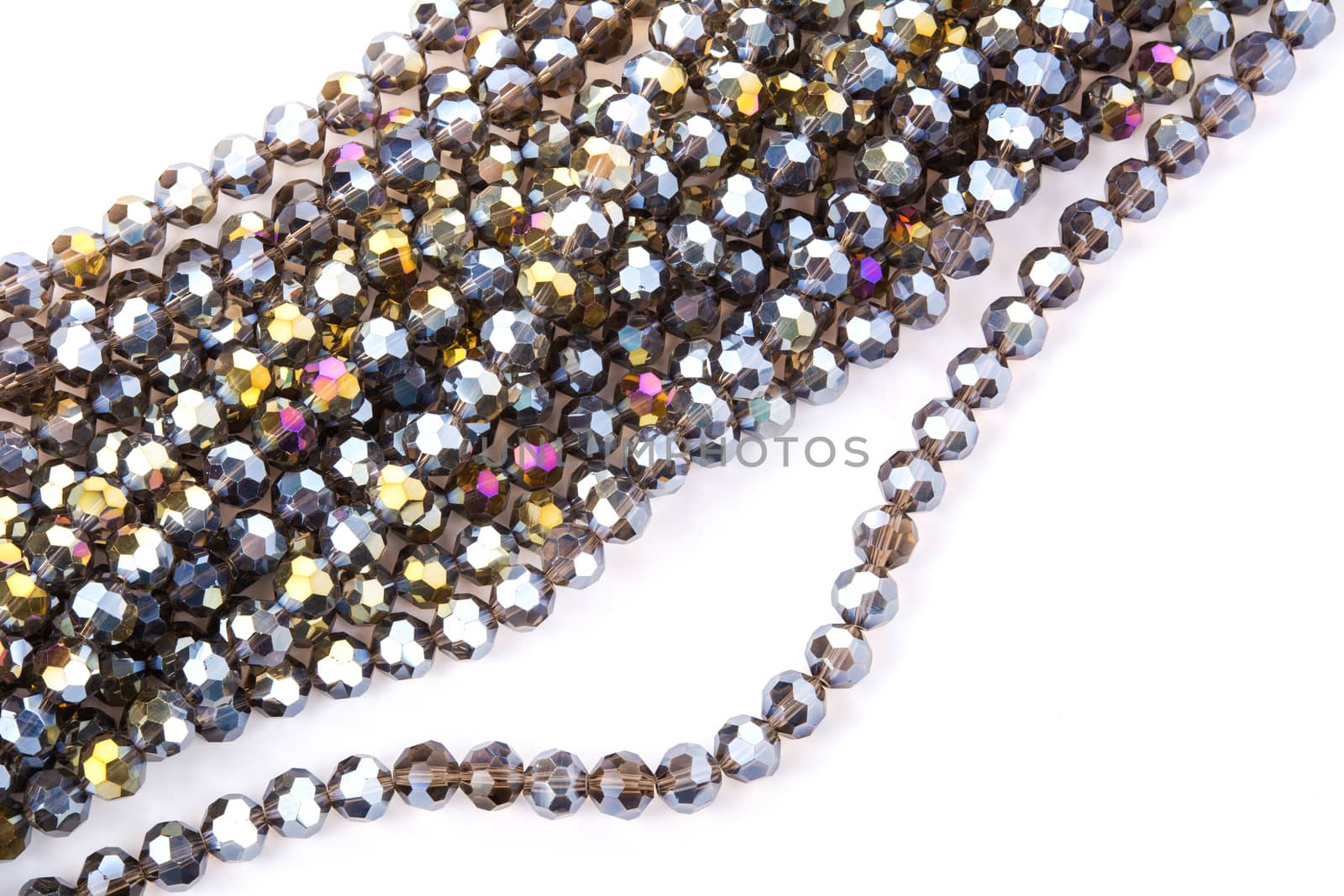 Beautiful gold beige brown Glass Sparkle Crystal Isoalted Beads on white background. Use for diy beaded jewelry. Space for text