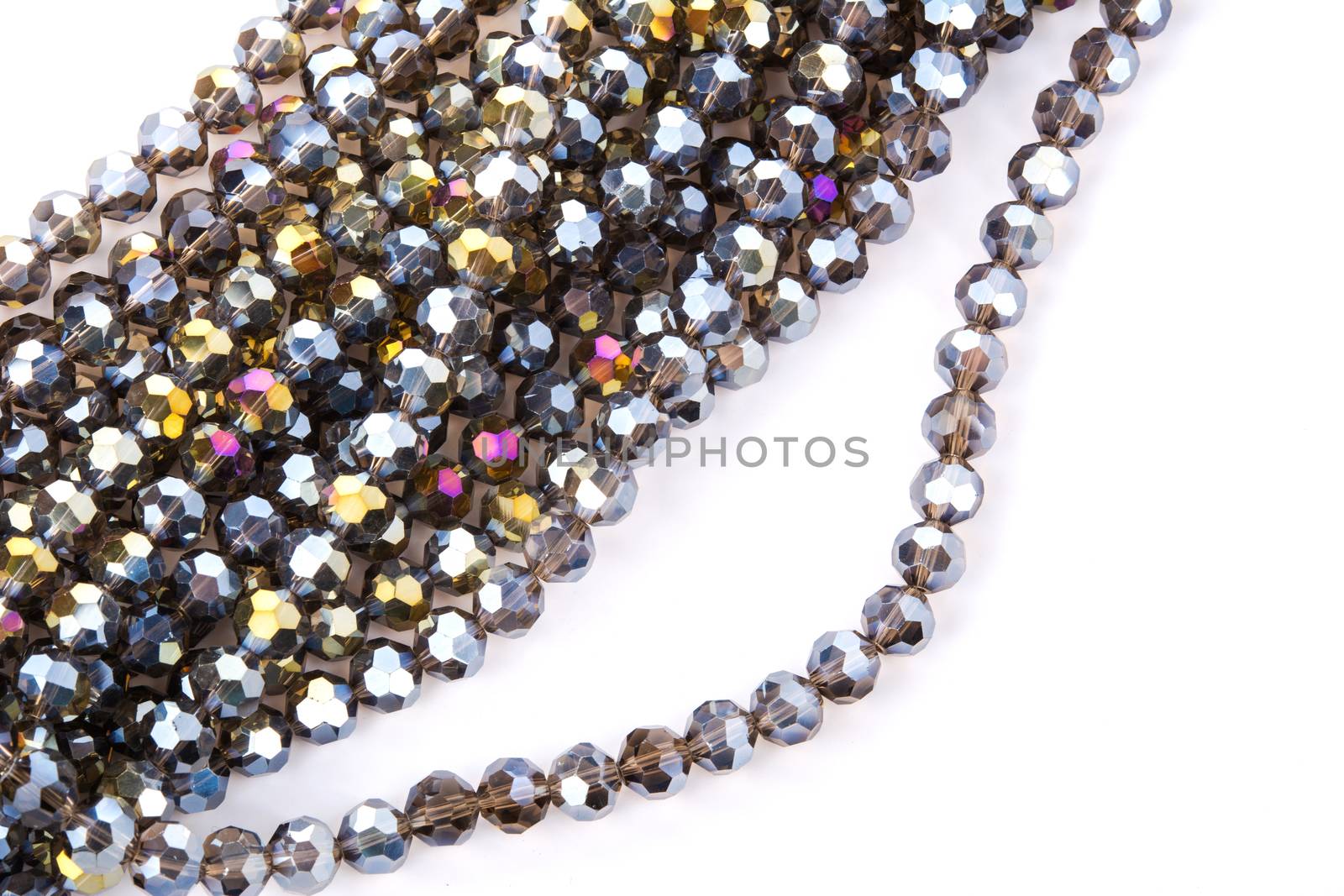 Beautiful gold beige brown Glass Sparkle Crystal Isoalted Beads on white background. Use for diy beaded jewelry. Space for text