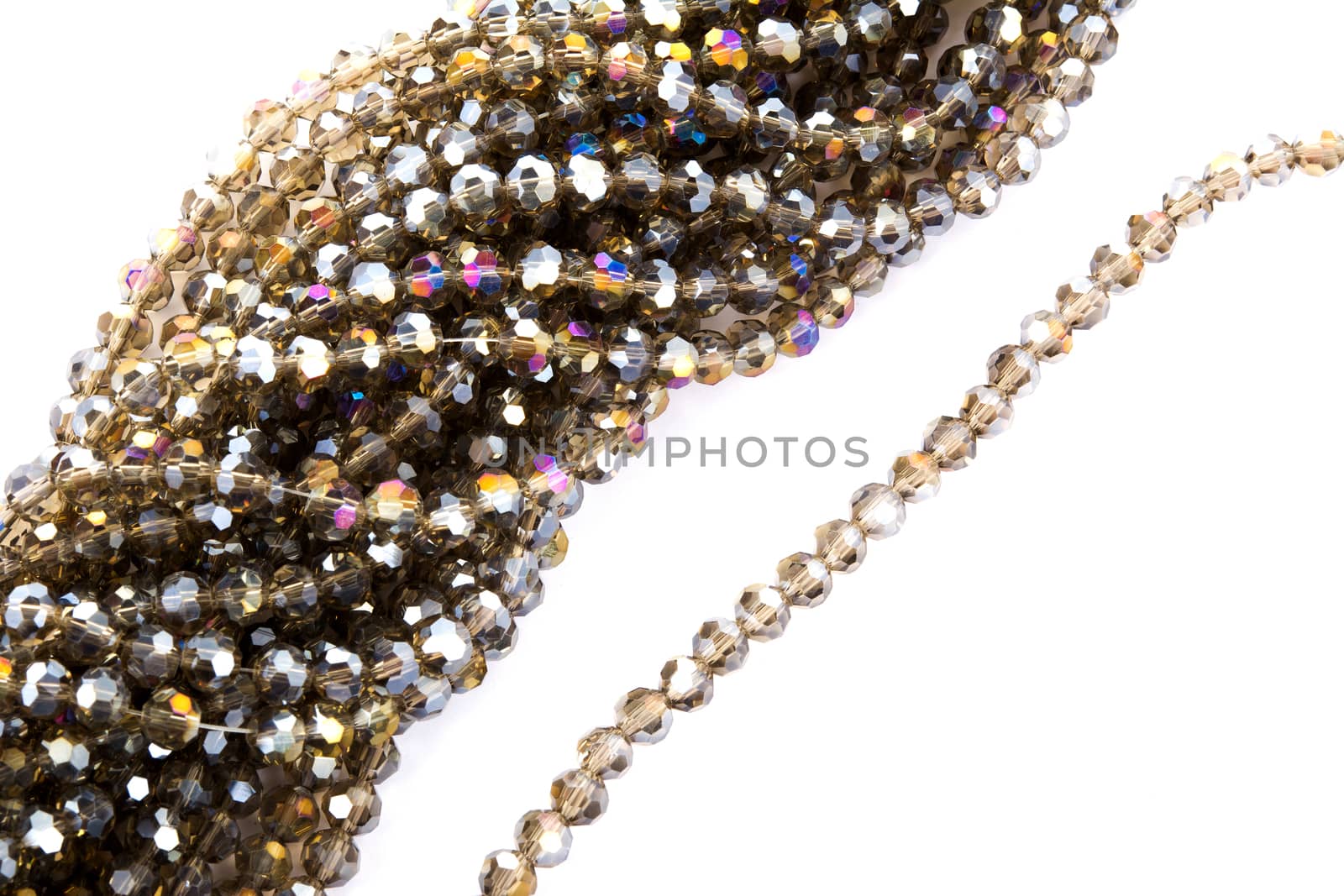 Beautiful gold beige brown Glass Sparkle Crystal Isoalted Beads on white background. Use for diy beaded jewelry. Space for text