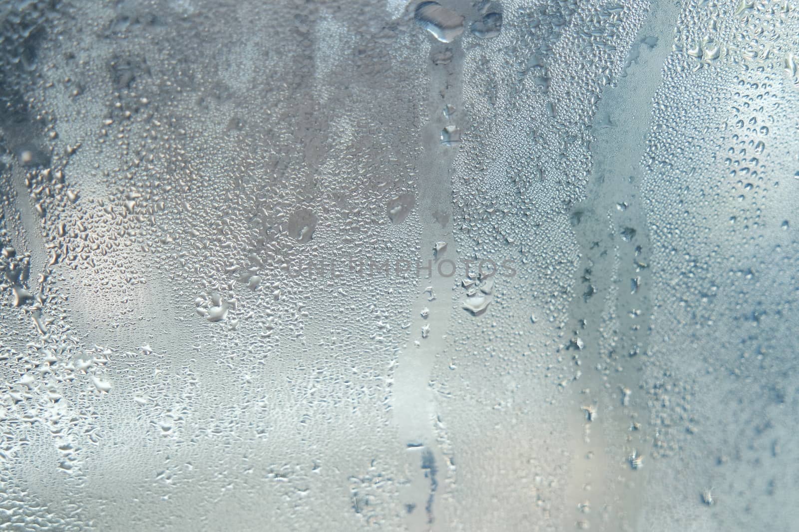 Bright grey color glassy texture, with water drops on it: abstract background
