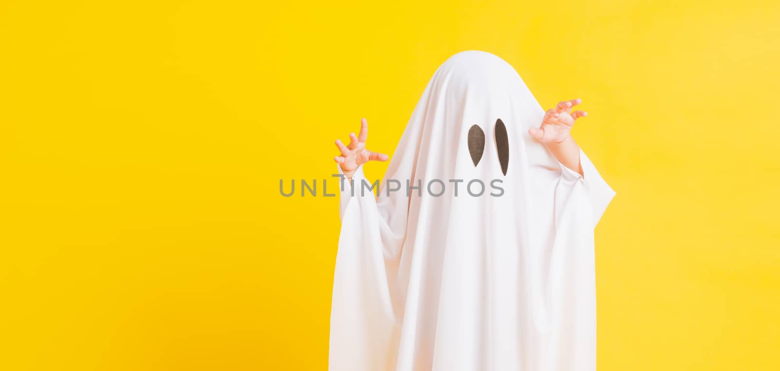 little cute child with white dressed costume halloween ghost sca by Sorapop