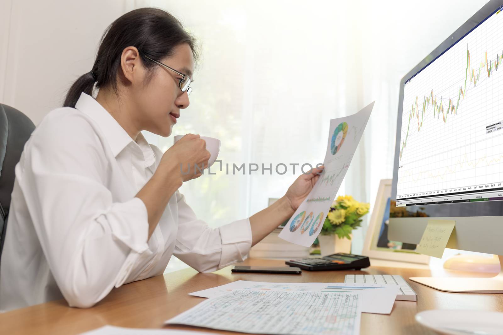 Asian business women working at home online meeting with video conference on computer. Business people using computer online meeting and speaking with team group.