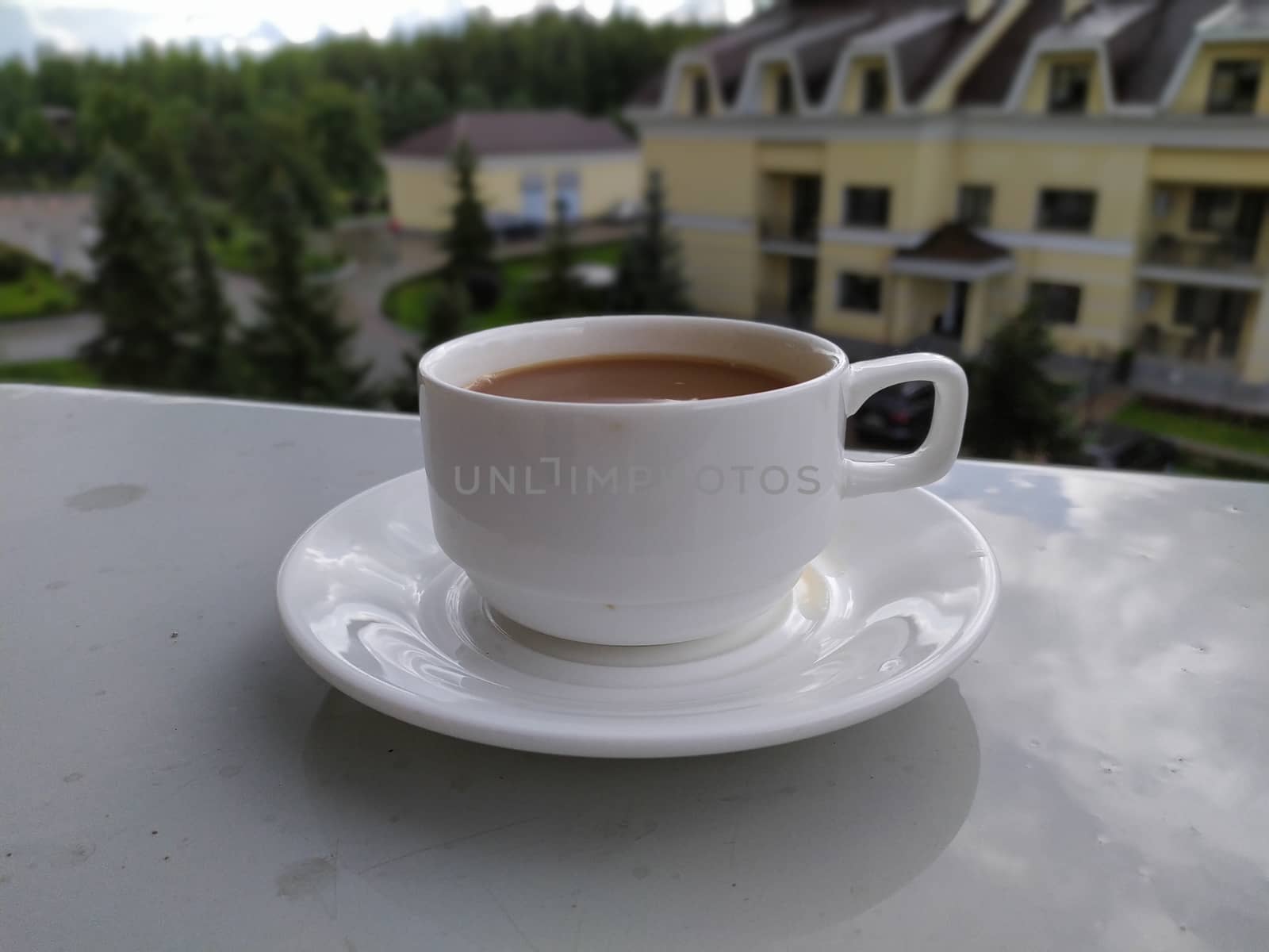 morning coffee on the windowsill of the balcony by marynkin