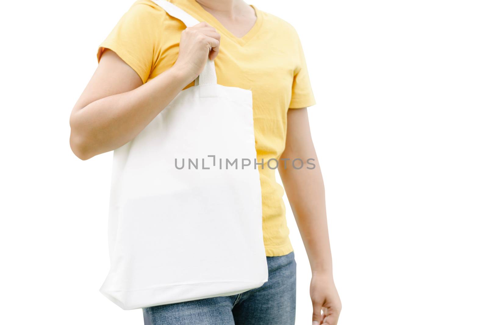 Closeup woman hand holding white bag canvas fabric isolated on white background, Save the world concept