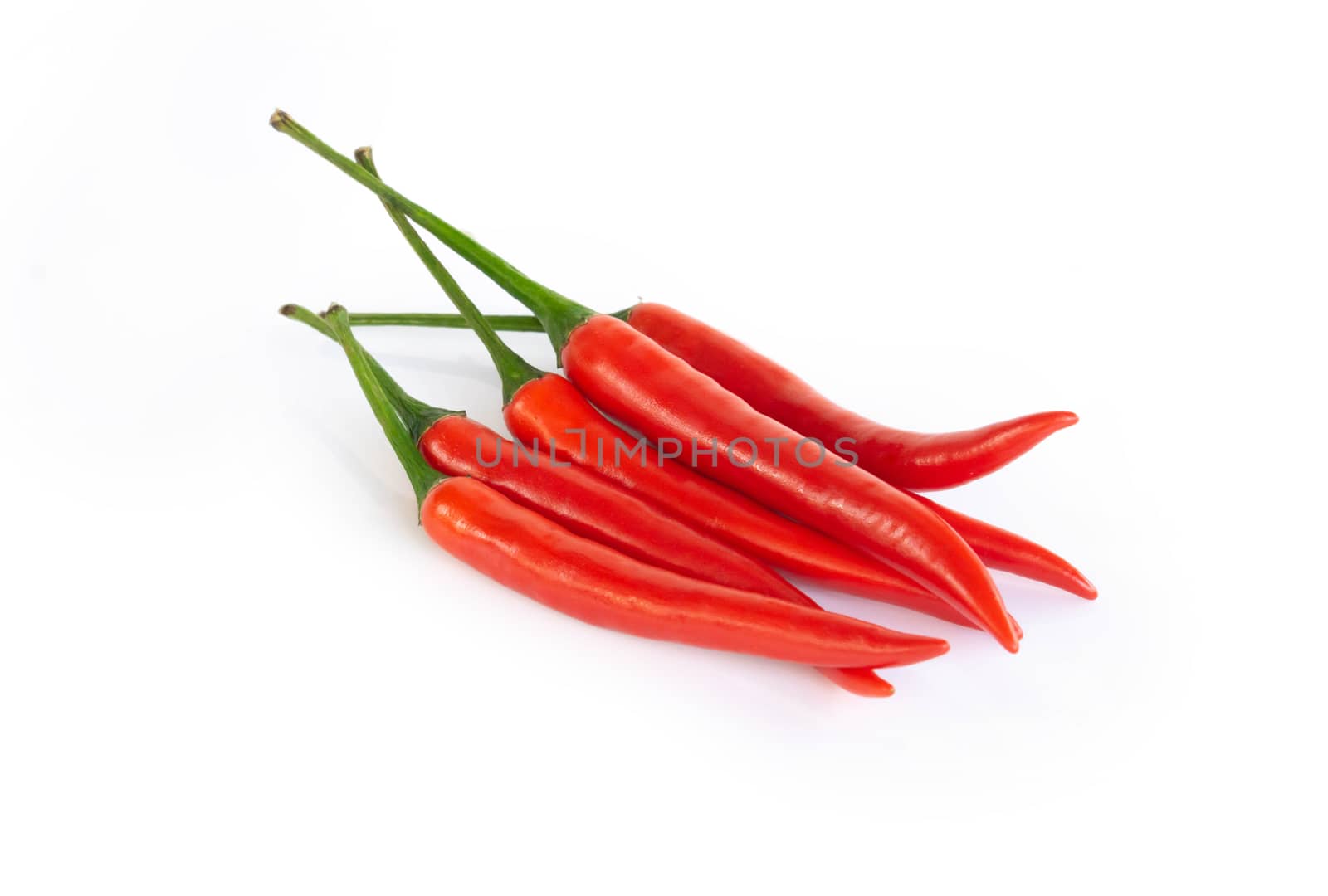 Closeup chilli pepper on white background, raw food ingredient concept