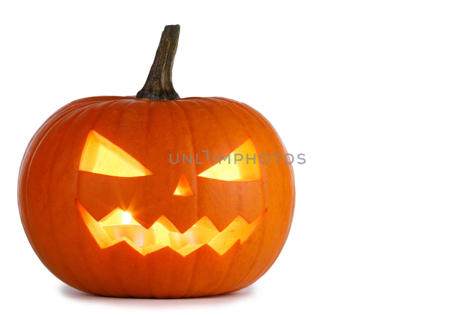 Glowing angry Halloween Pumpkin isolated on white background