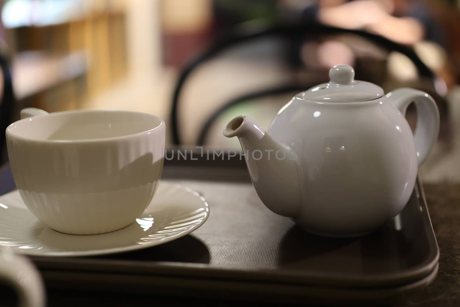 Cup of coffee and teapot by uphotopia