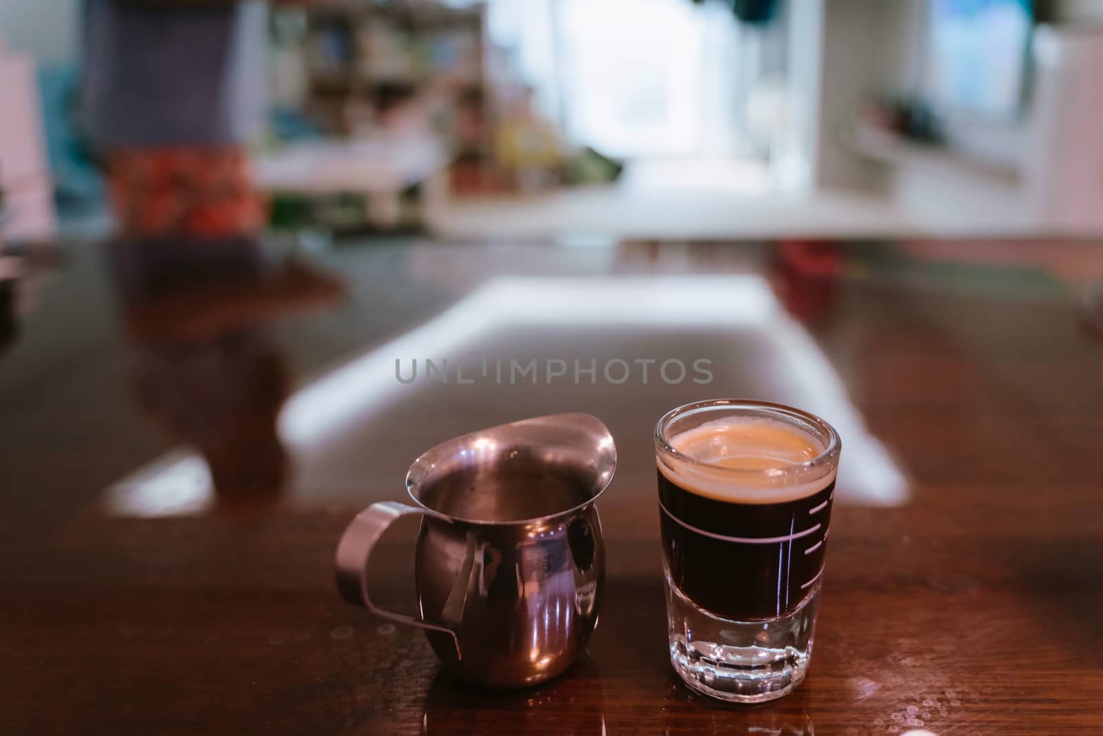 Cup of coffee on wooden table by uphotopia
