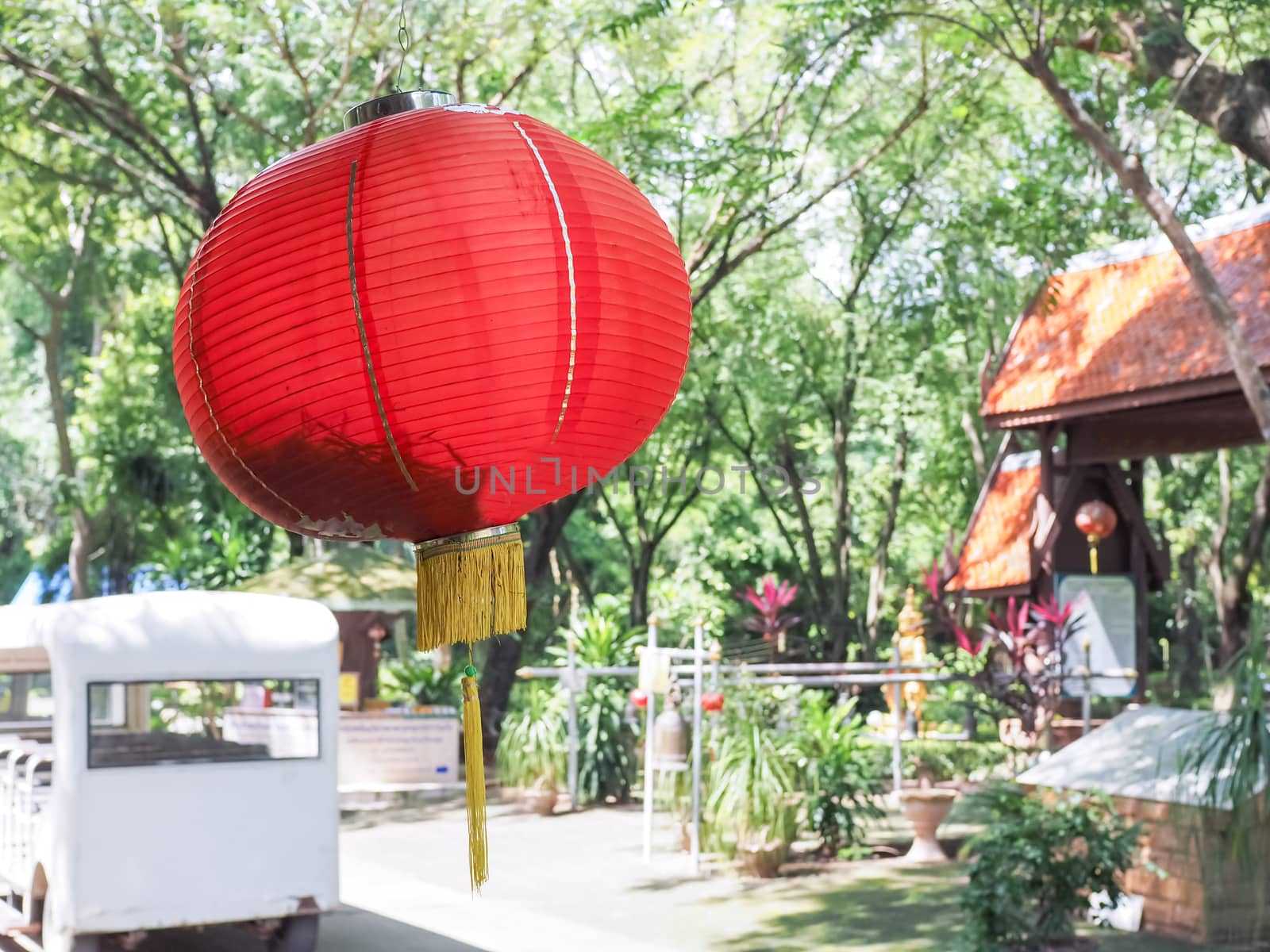 A red lantern hanging on the roof