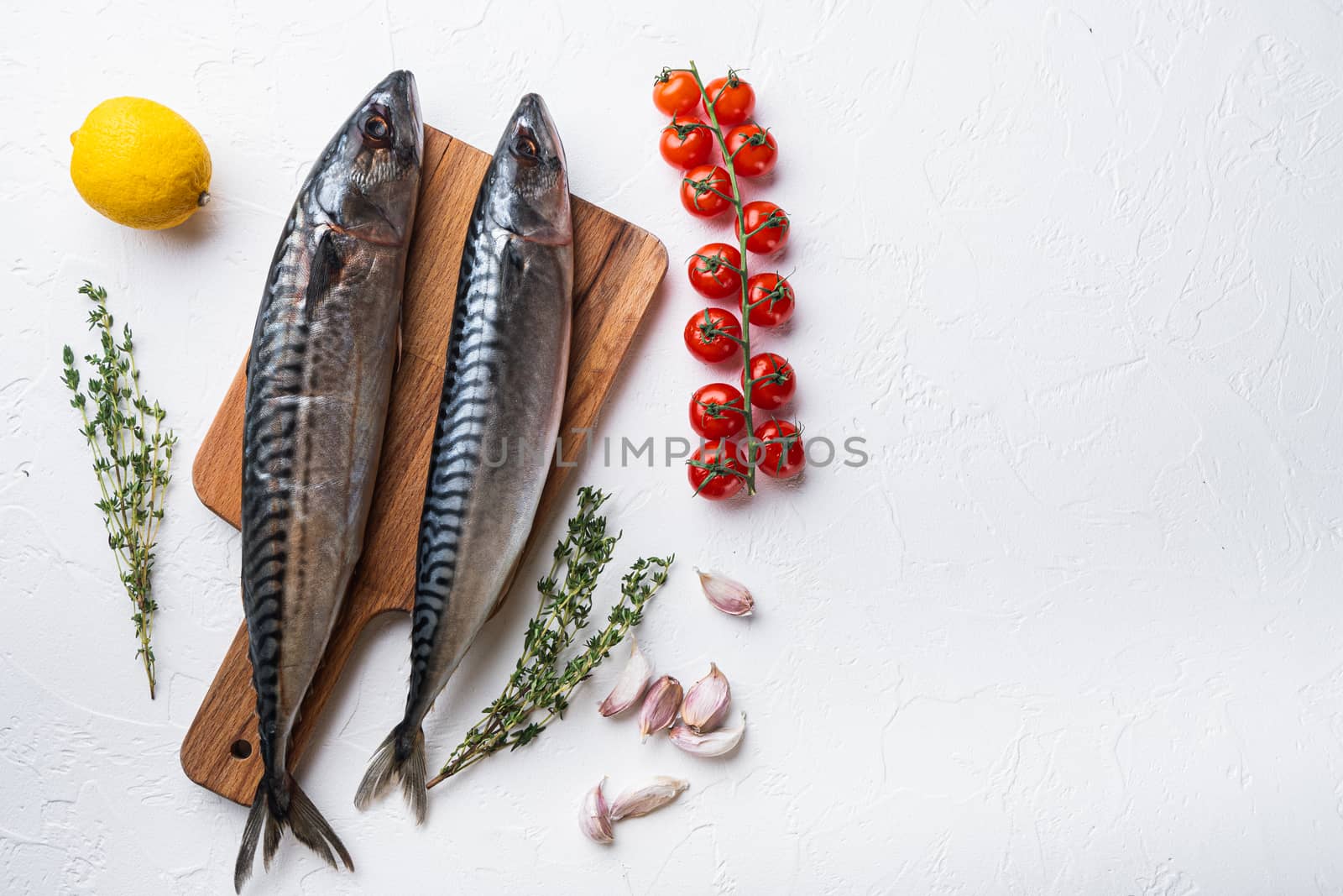 Raw mackerel with herbs on white background, flat lay with space for text.