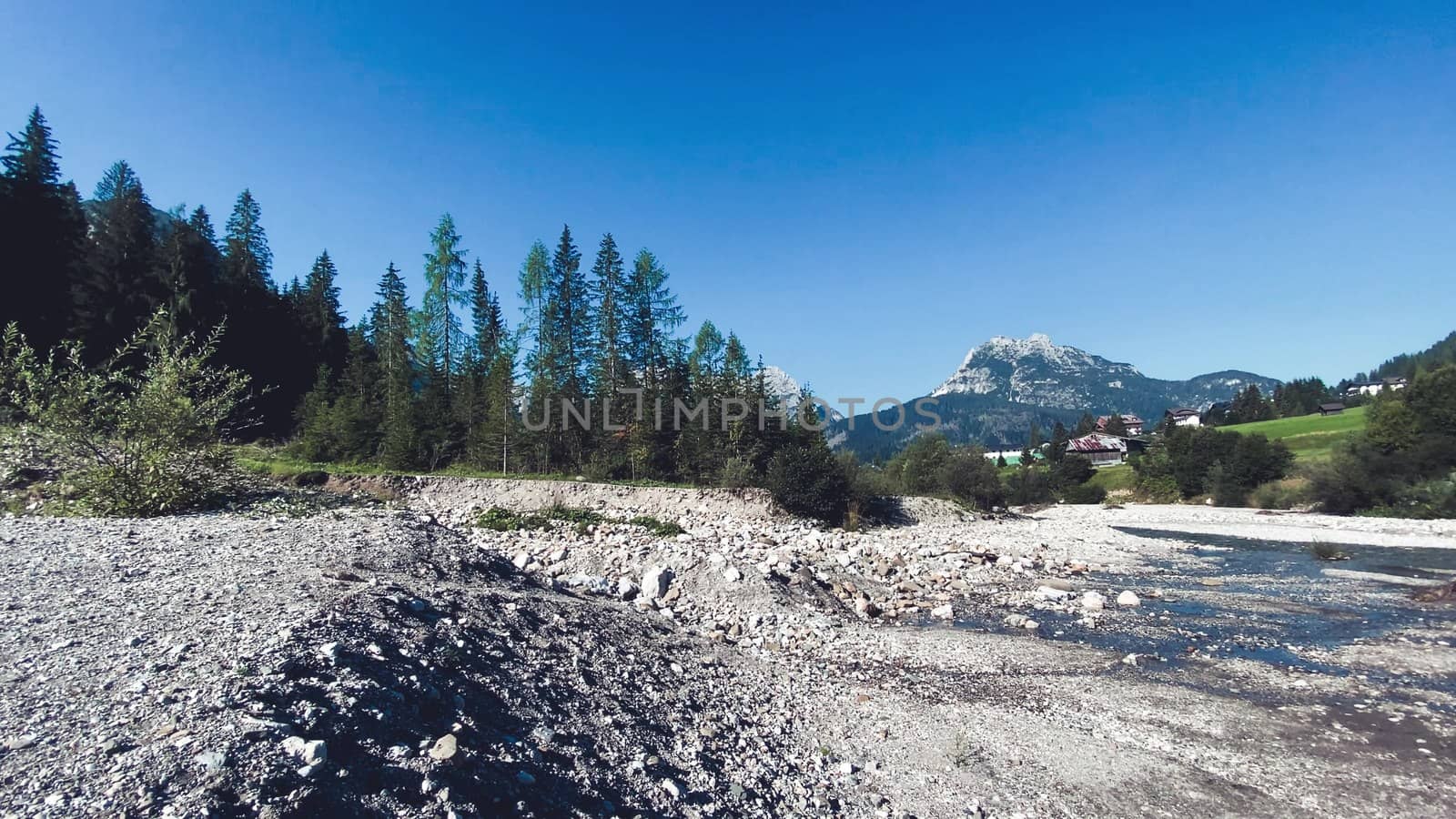 Sappada, Italian Alps. Panoramic view of Piave river and city landscape in summer season.