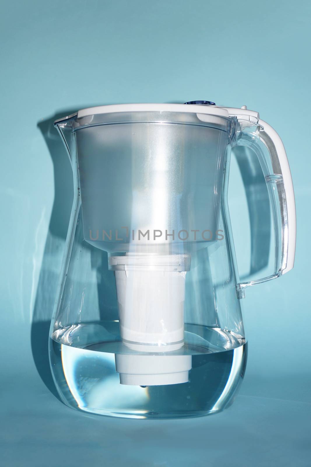 a jug for filtering water on a blue background.