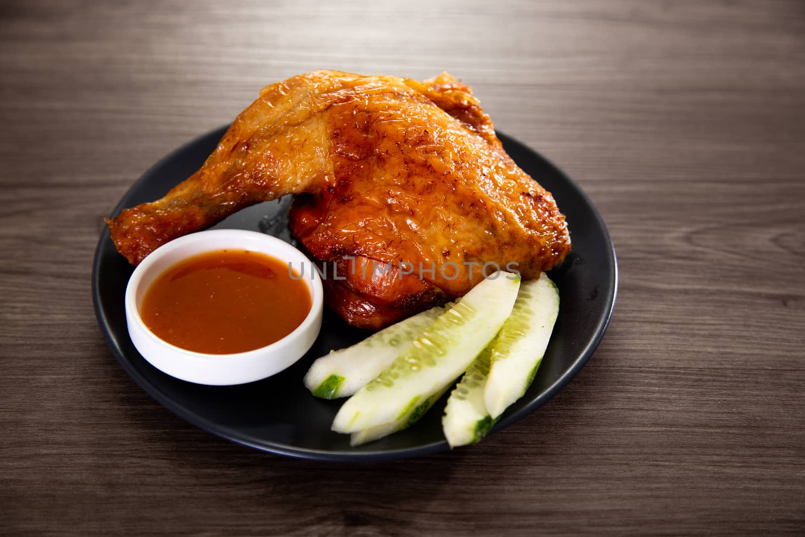 roasted chicken and vegetables on wooden table
