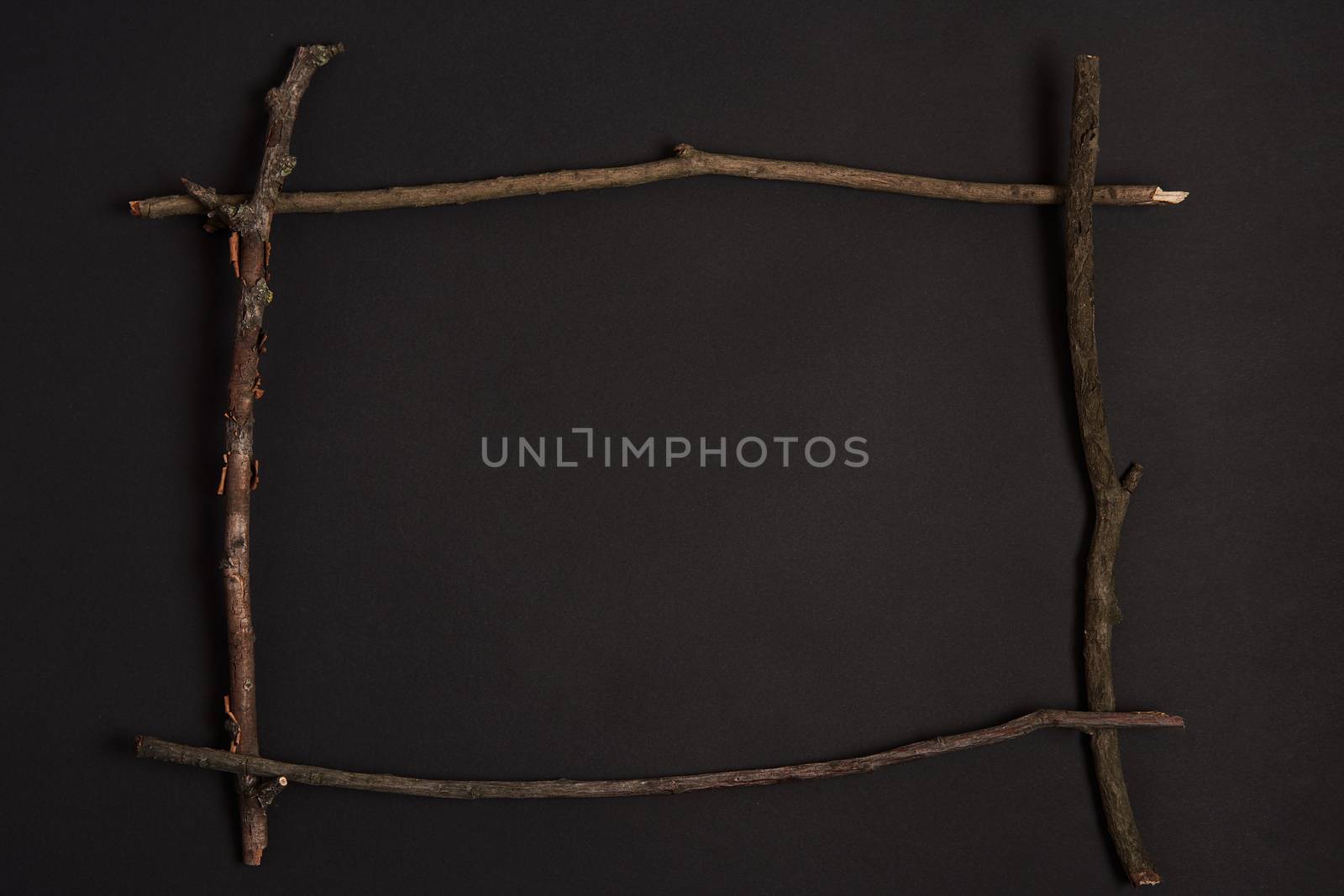 Walloween background Border square frame made wooden dry branch stick Placed center on black paper background