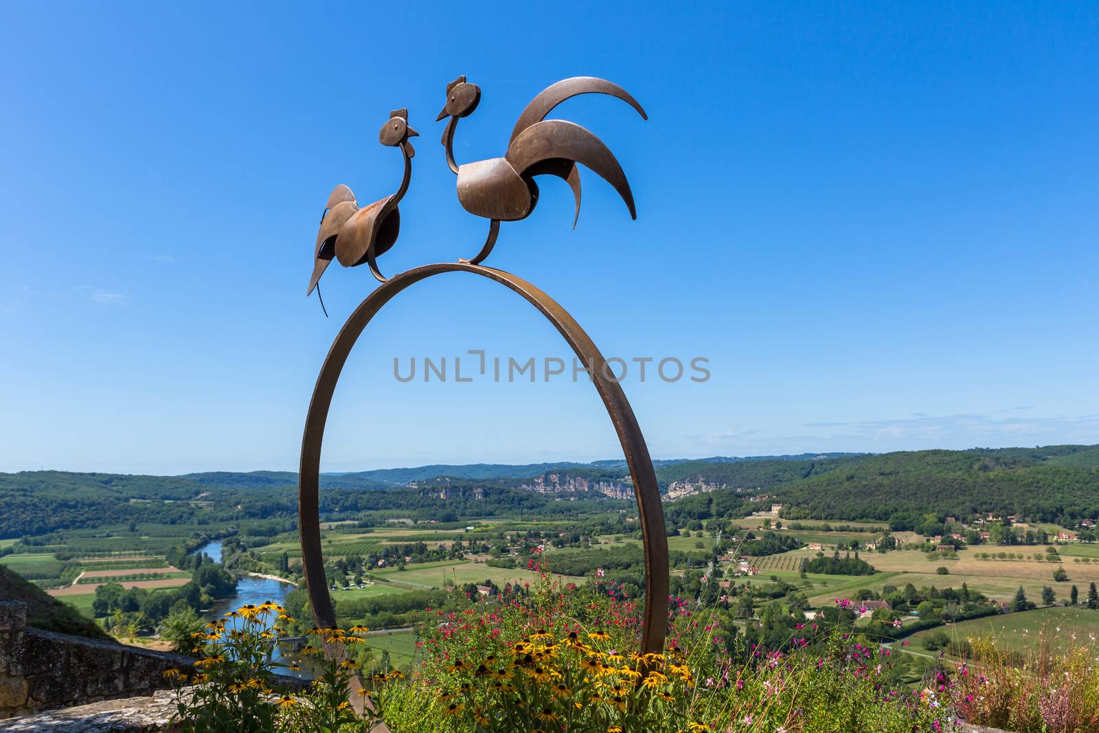Domme, France - Symbolic roosters and view of the Dordogne Valley from the walls of the old town of Domme, Dordogne, France