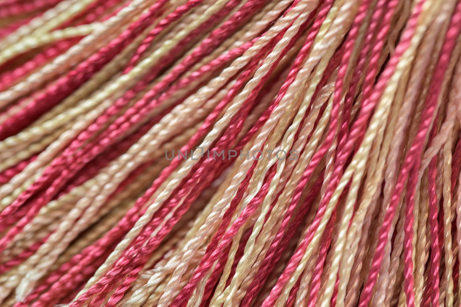 Background of multicolored threads. Embroidery thread yarns.