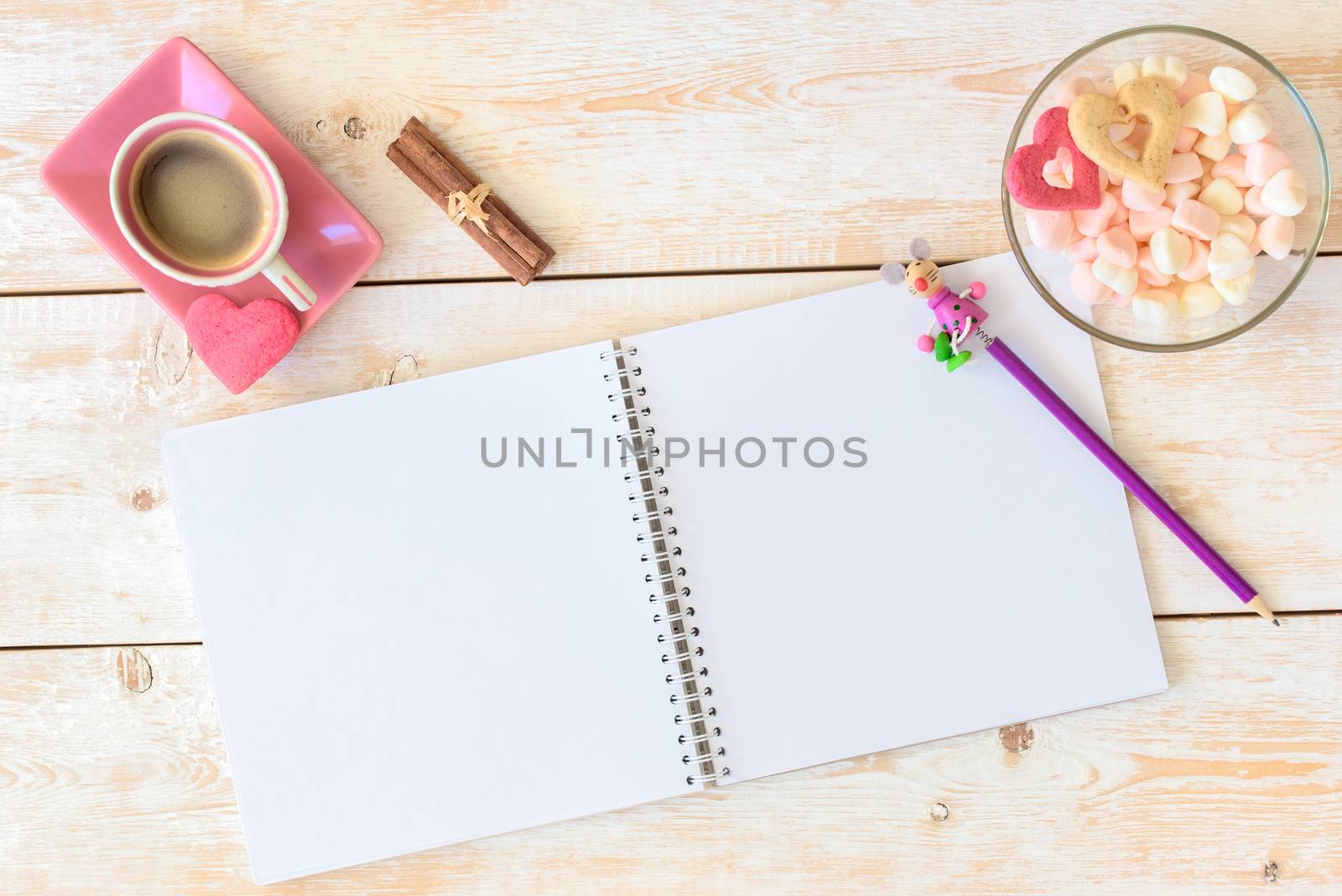 Blank paper on table. Blank sheet of paper, coffee cup, cookie, pencil on wood background. Sketchbook mockup