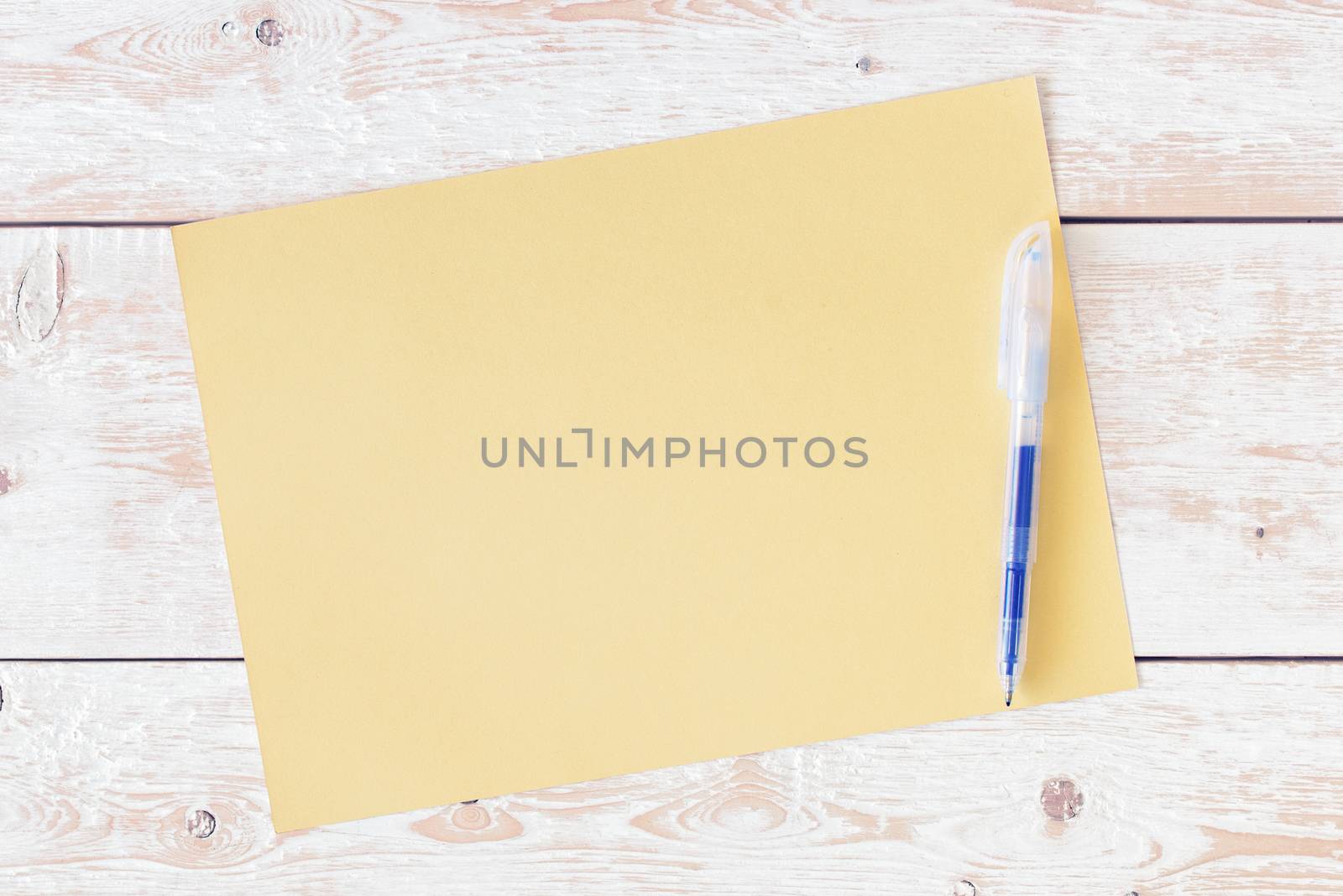 Letter on desk. Blank sheet of paper, pencil on wood background. Design mockup