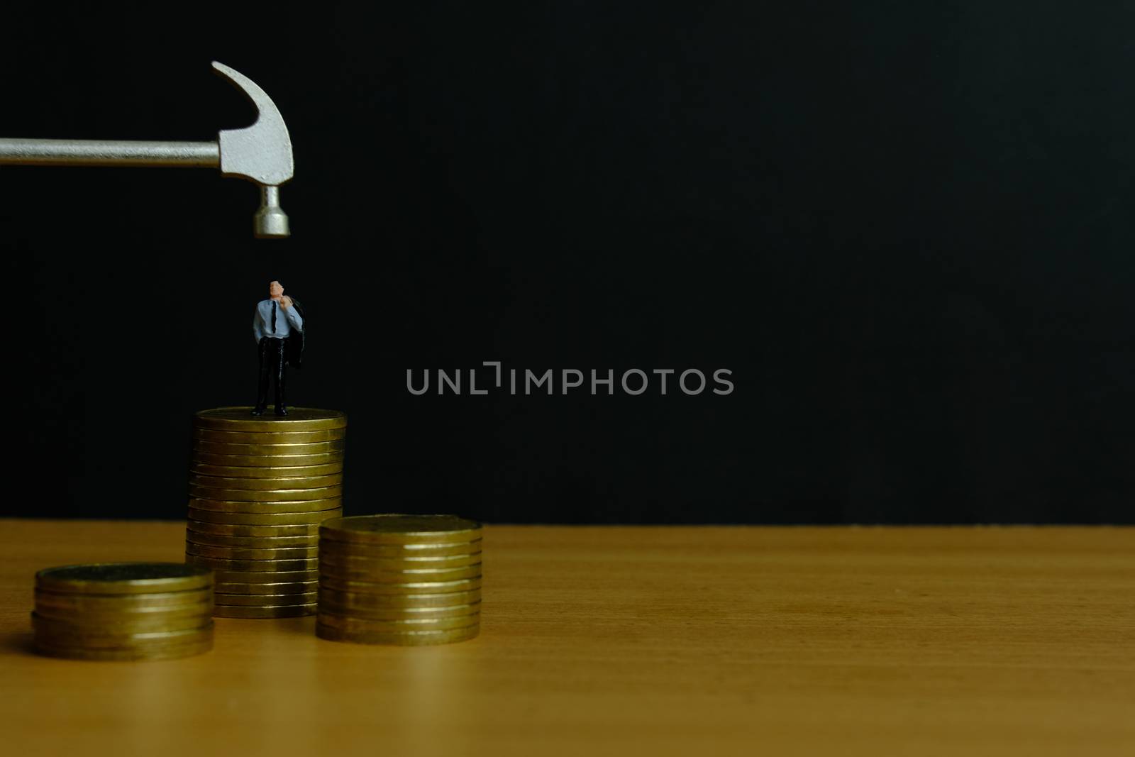 Miniature people concept - businessman stress thinking about financial crisis (toys photography )