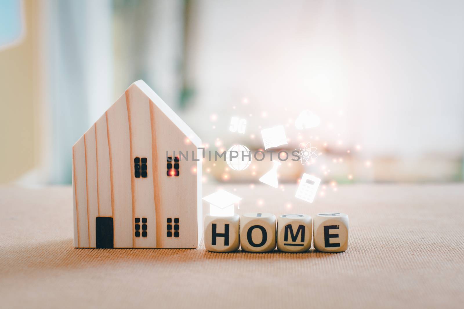 Home school and e-learning concept. Wooden home with white education icons on wooden table with copy space. 