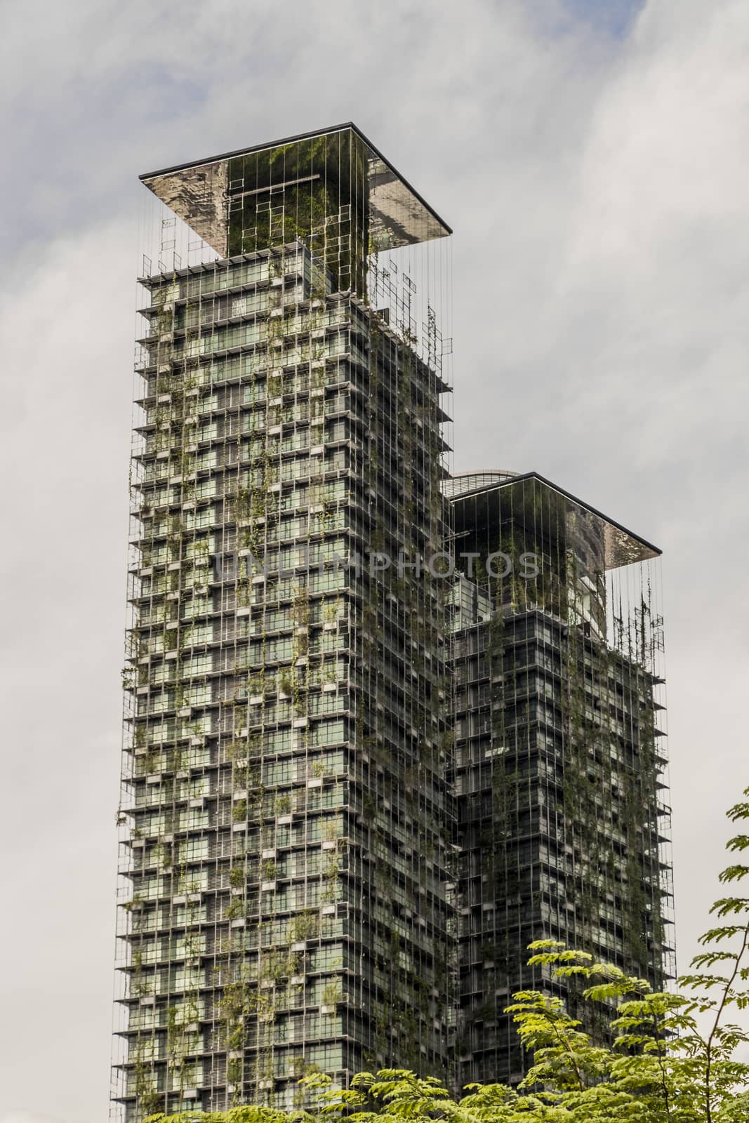 Le Nouvel KLCC ecological skyscraper with plants, Kuala Lumpur, Malaysia. by Arkadij