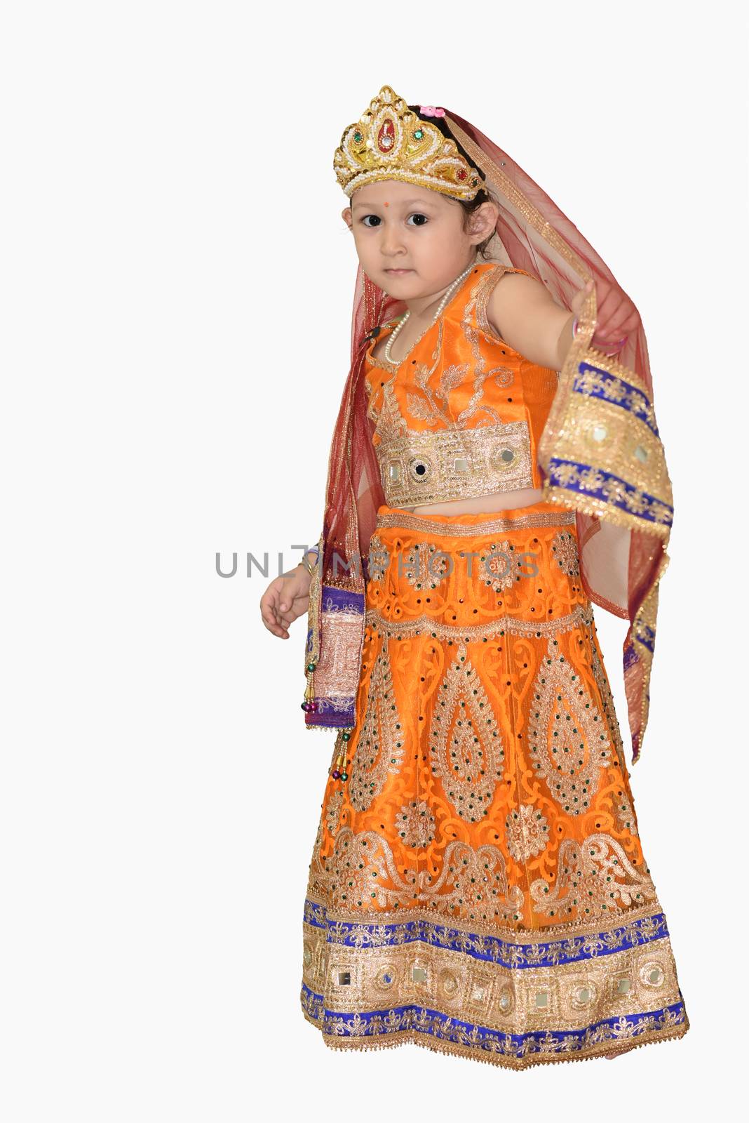 Little girl in Indian traditional dress isolated on white background.