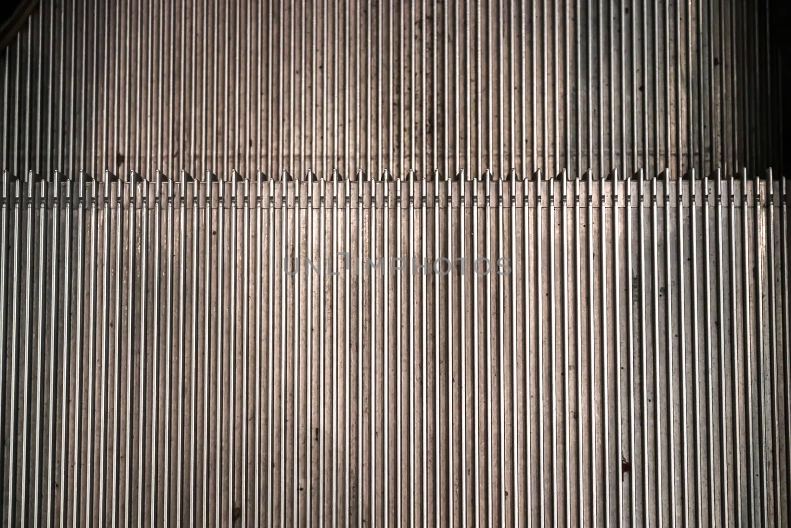 Close up of empty steps of an escalator in a perspective view. by MP_foto71