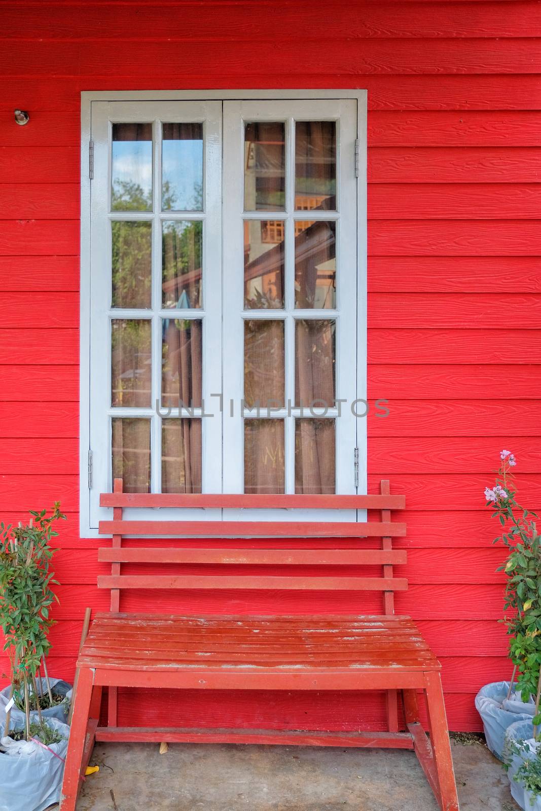 Red house and white window 