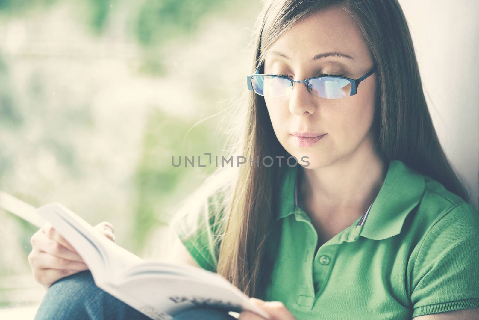 Girl reading book by Visual-Content