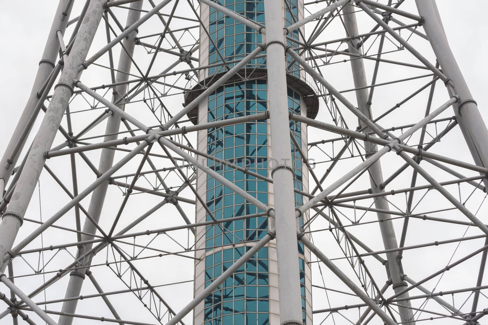 Iron high tower. Observation tower on a white background