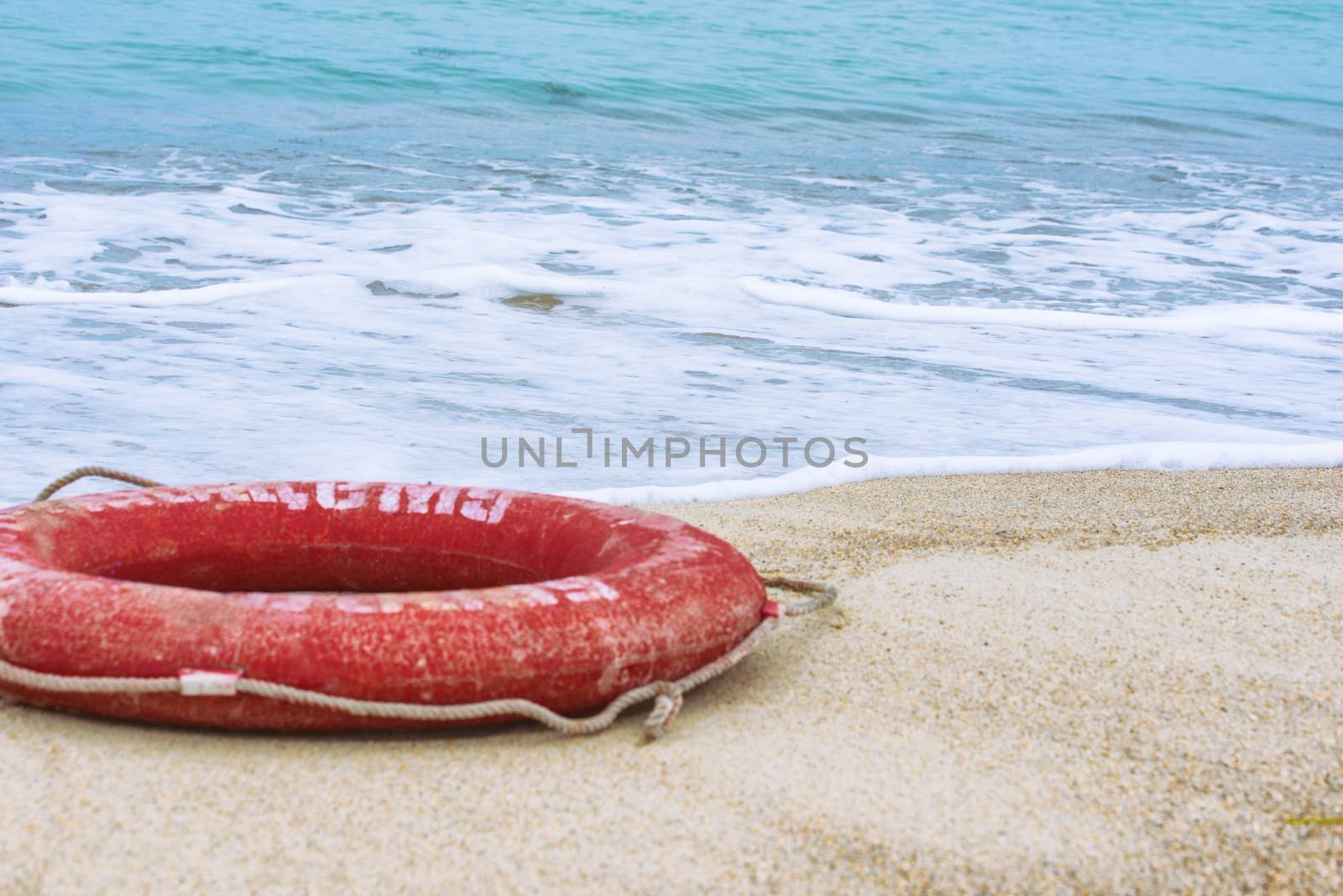 Lifebuoy on the beach by Visual-Content