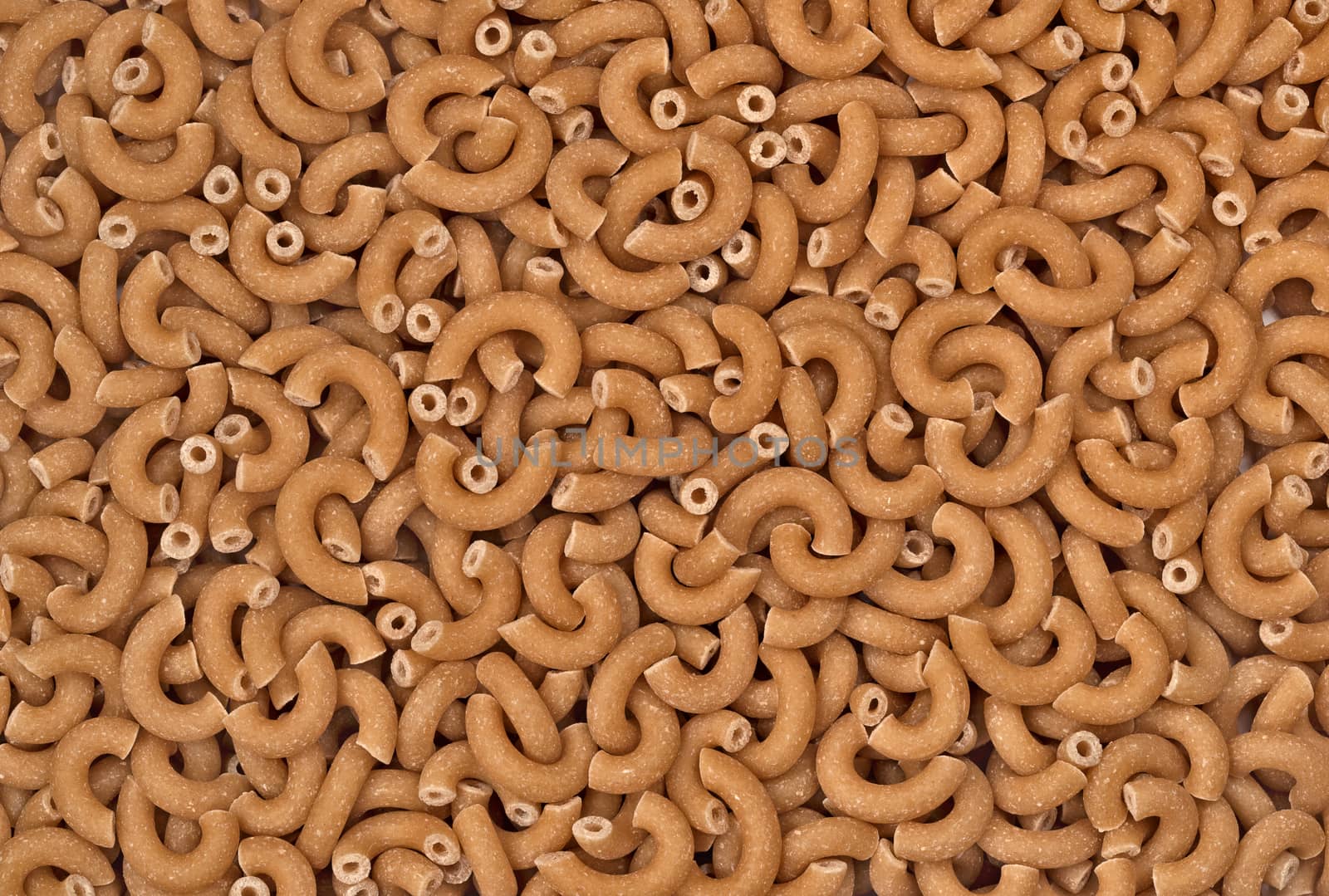 Macaroni for background. Macaroni texture. Pasta top view