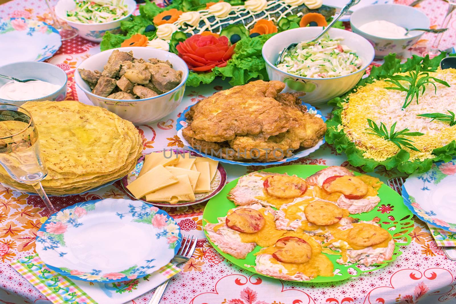 Round table full of food. Meal on the round table