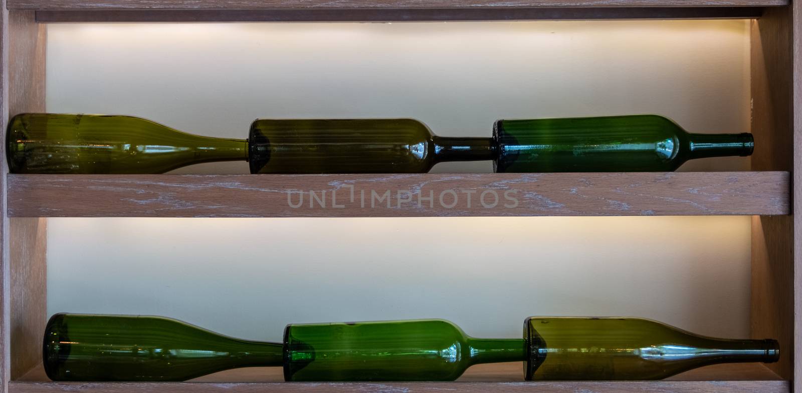 Background of wine bottles in green tones for graphic design or decoration