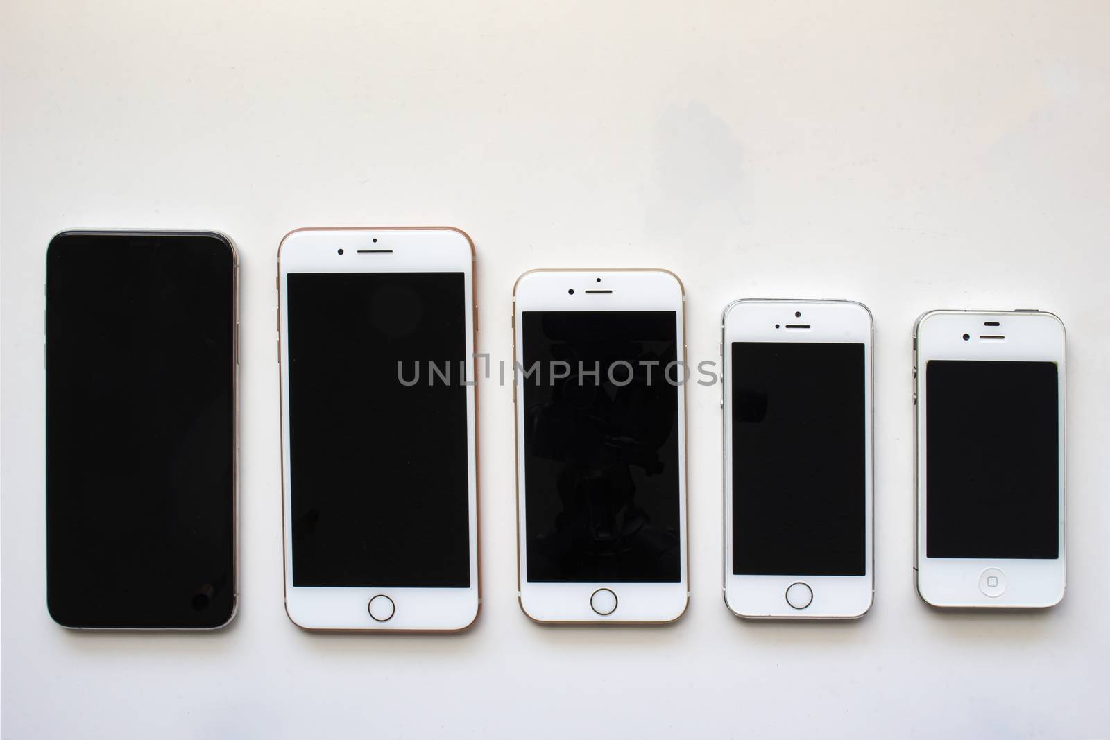 Calgary, Alberta, Canada. Aug 22, 2020. Several iPhone screens from view on a white background. by oasisamuel