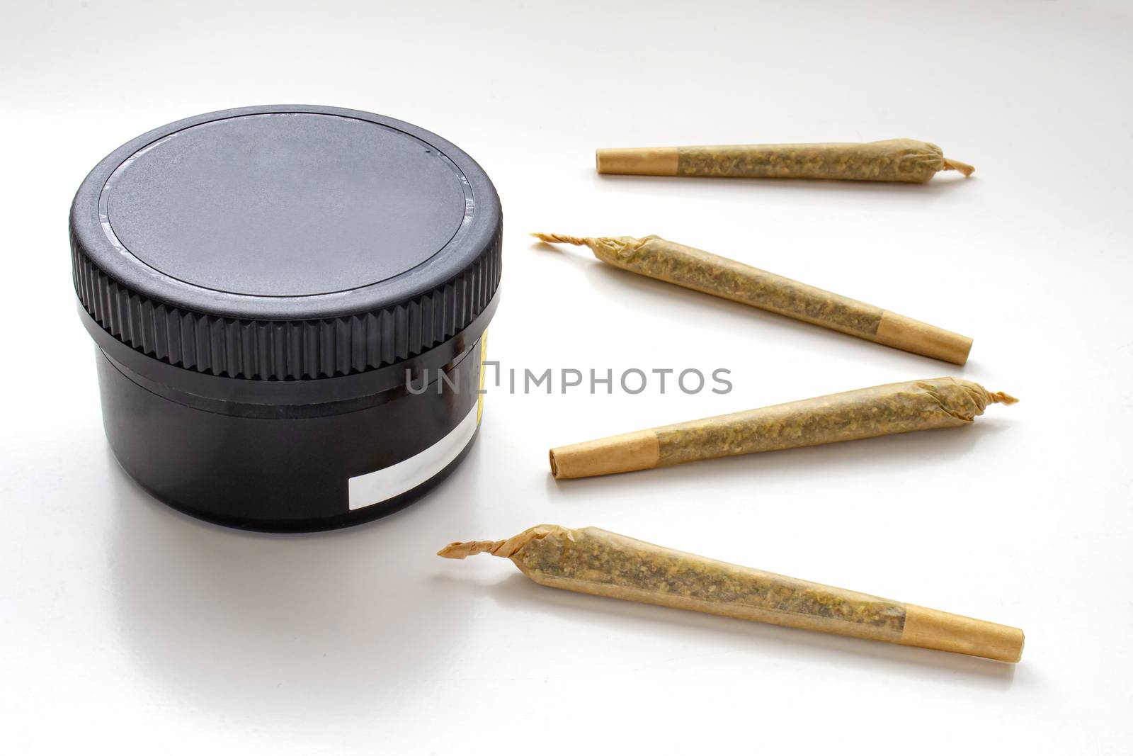 A Cannabis black plastic packaging container with Cigarettes, Prerolls or Joints on a white background