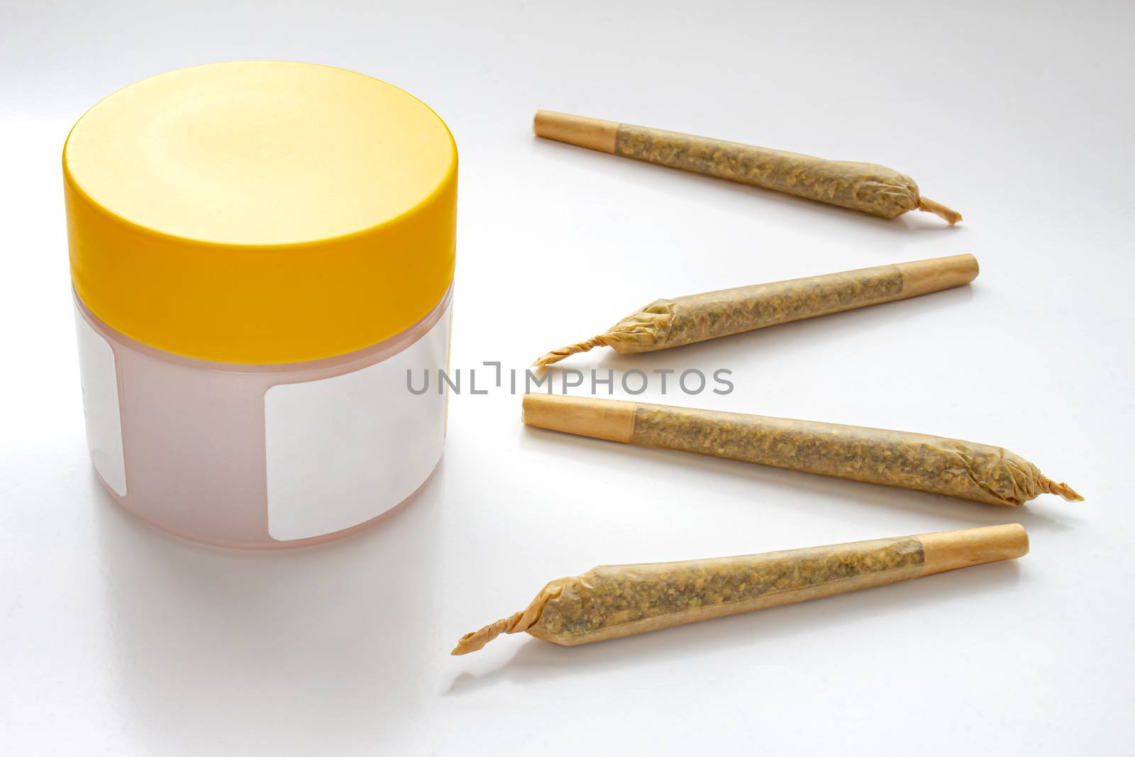 A Cannabis white and yellow plastic packaging container with Cigarettes, Prerolls or Joints and a on a white background by oasisamuel