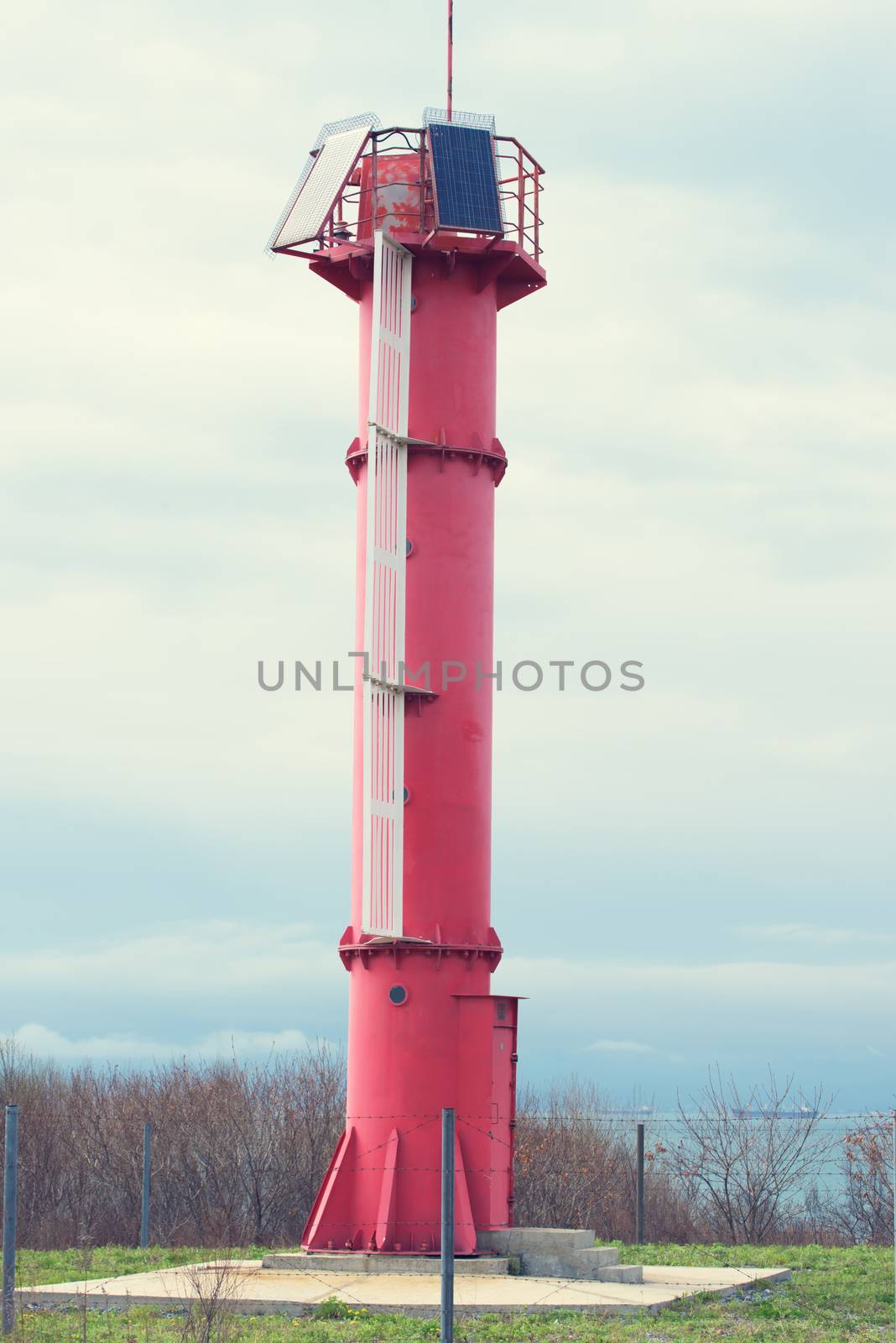 Red sea lighthouse. Modern lighthouse on the beach