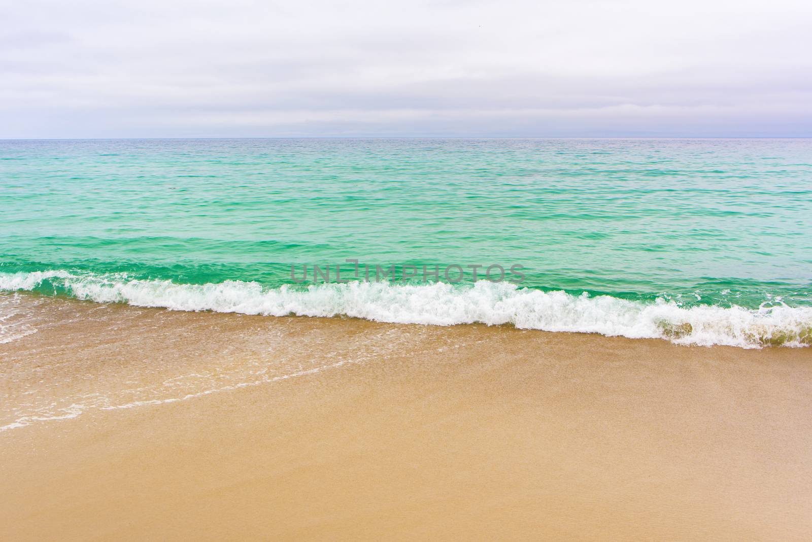 Sea surf on the beach. Sand beach and turquoise sea