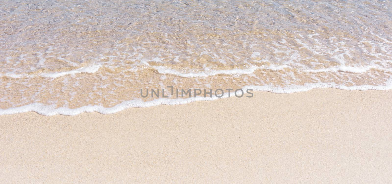 Wave of sea on the beach. Beautiful ocean wave on sandy beach.